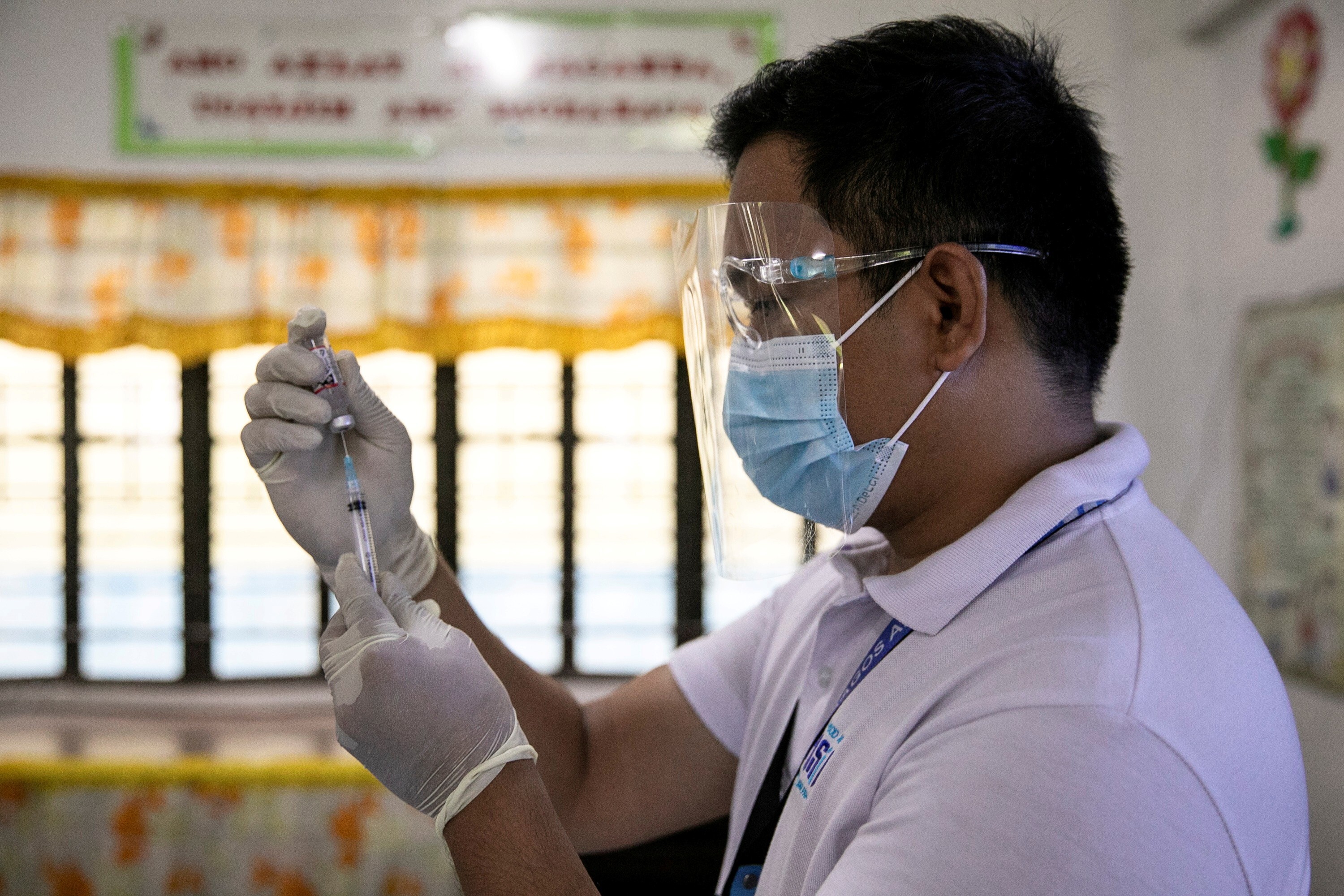 A health worker in Metro Manila participates in a simulation for the Philippines’ Covid-19 vaccination drive. Photo: Reuters