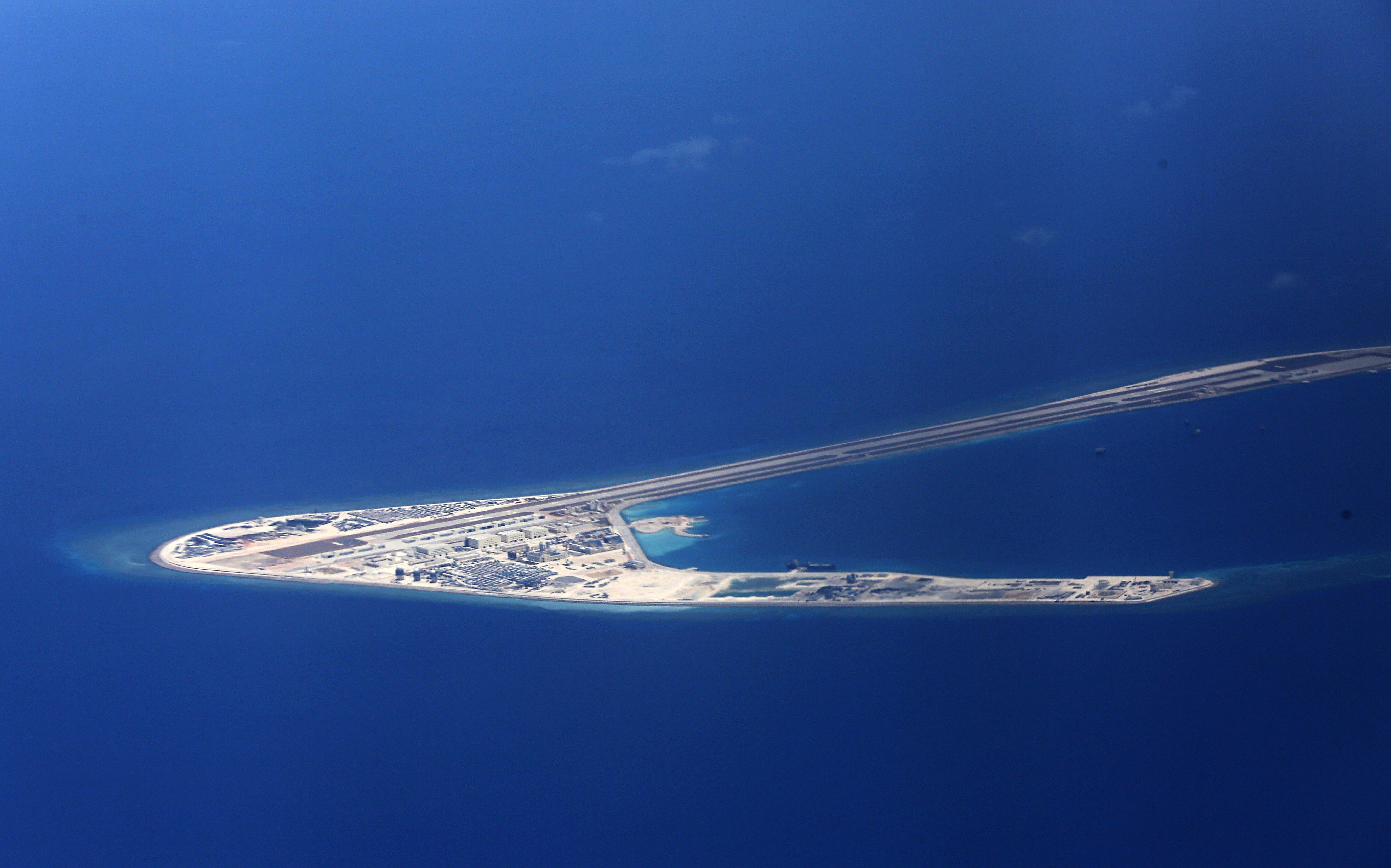 Chinese structures and an airstrip are seen on Subi Reef in the disputed Spratly Islands in the South China Sea. Beijing refused to accept a 2016 international tribunal ruling that rejected its territorial claims. Photo: AP