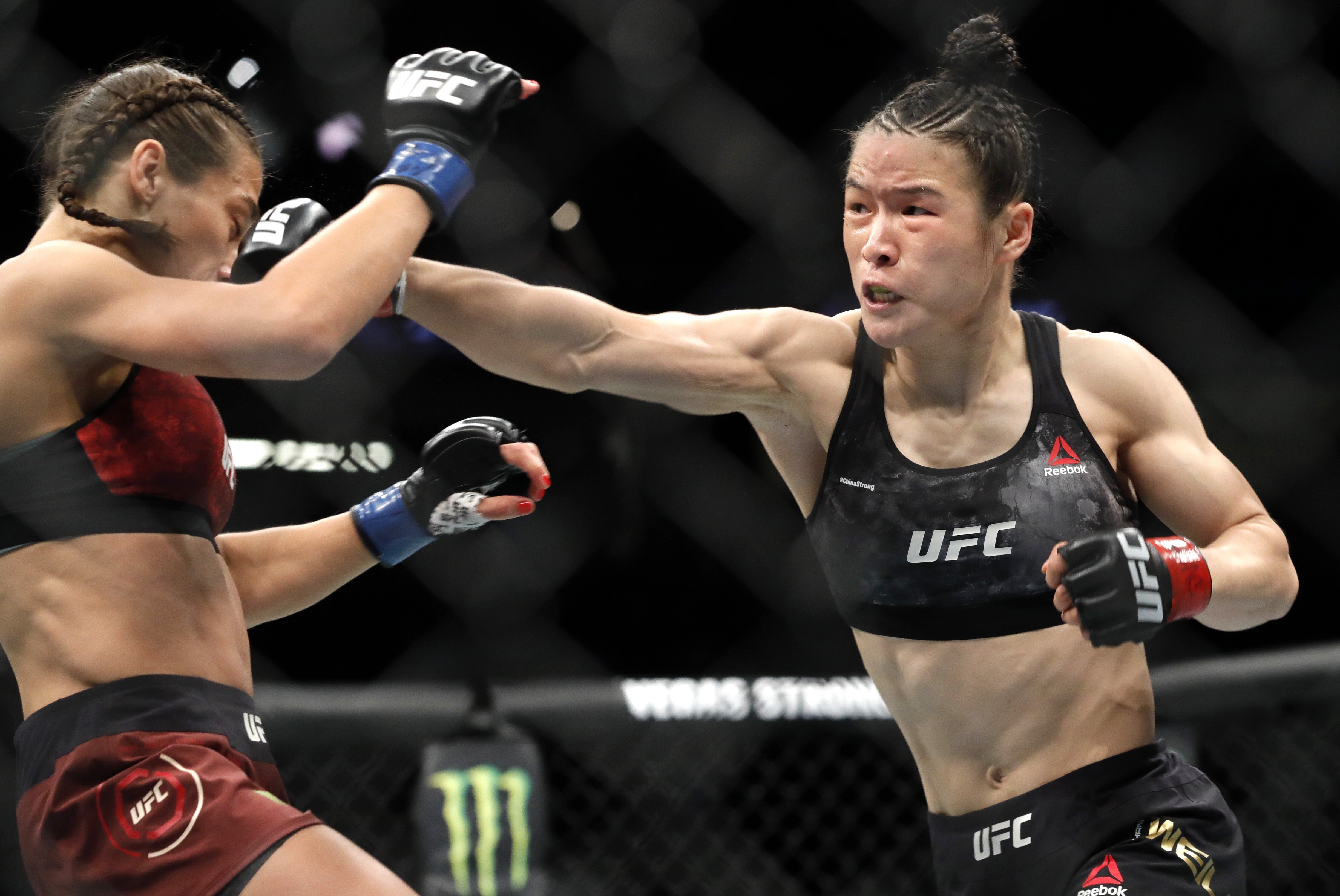 UFC women's strawweight champion Zhang Weili of China punches former champion Joanna Jedrzejczyk of Poland at UFC 248 in March, 2020. Photo: AP