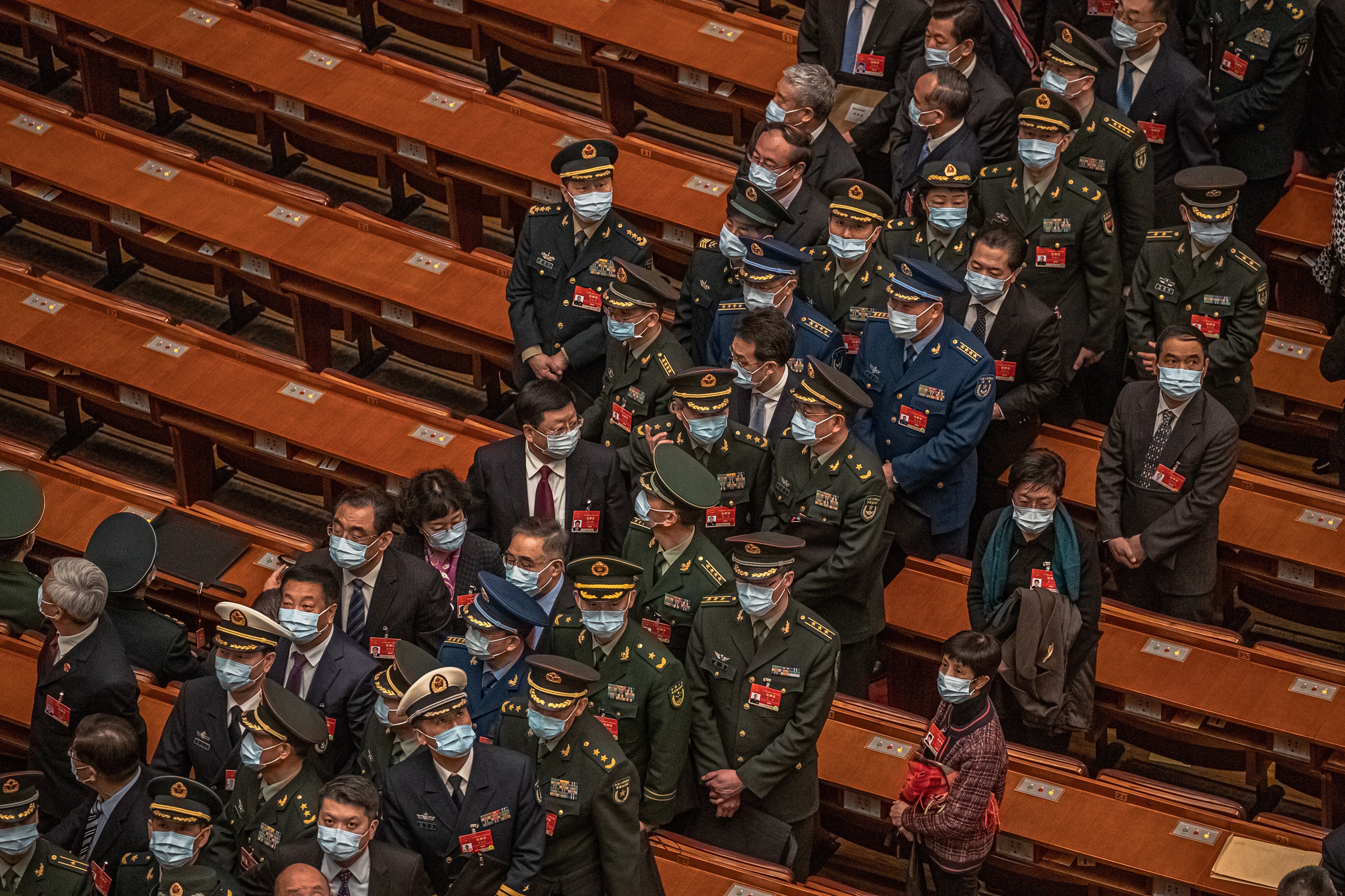 Military officers and other delegates leave after the second plenary session of the National People’s Congress in Beijing on Monday. Photo: EPA-EFE