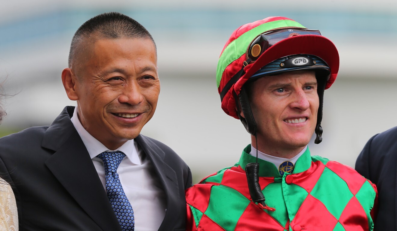 Trainer Danny Shum and jockey Zac Purton celebrate a Regency Legend victory.