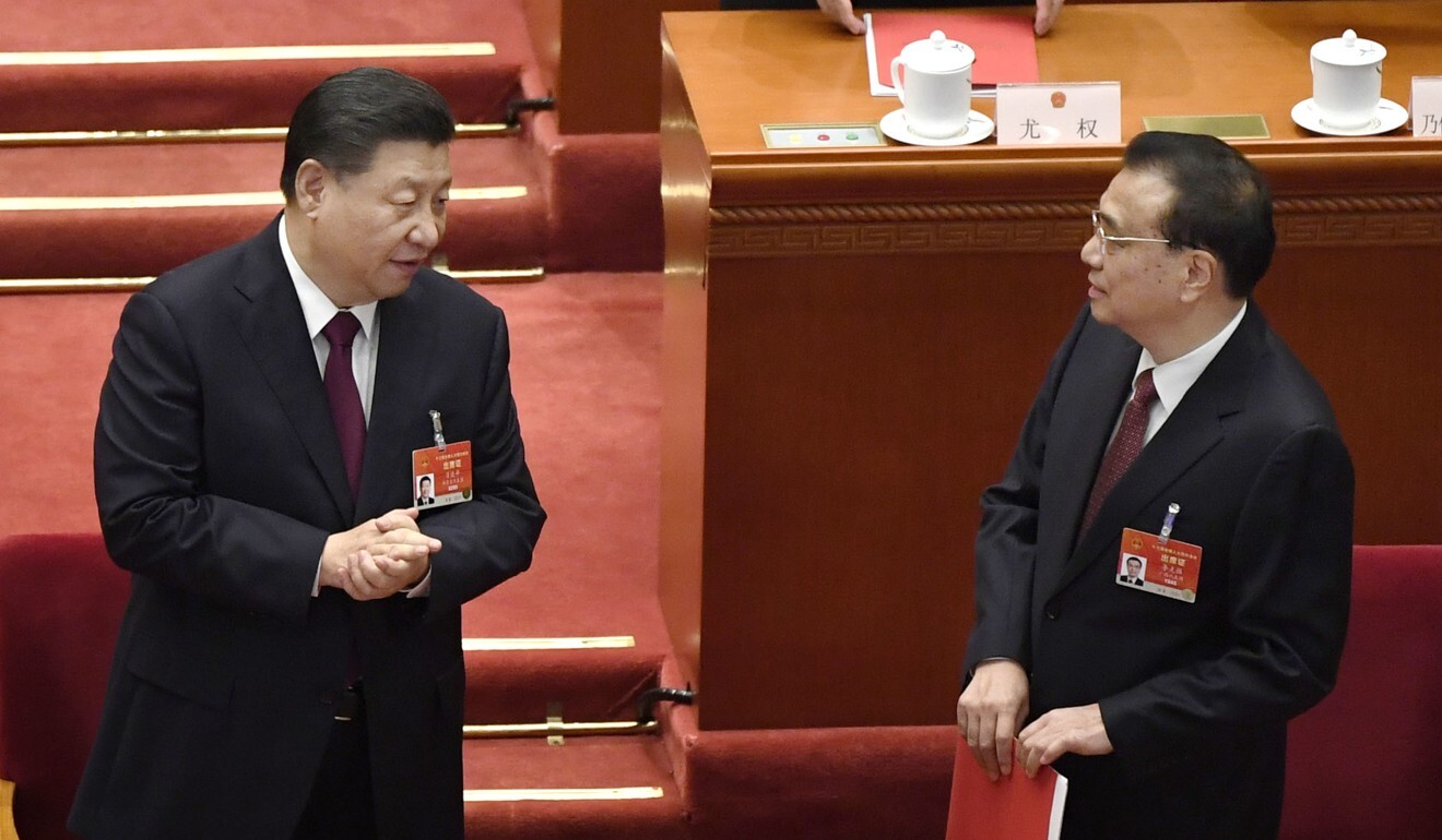 Chinese President Xi Jinping and Premier Li Keqiang exchange words after the closing session of the National People's Congress on Thursday. Photo: Kyodo