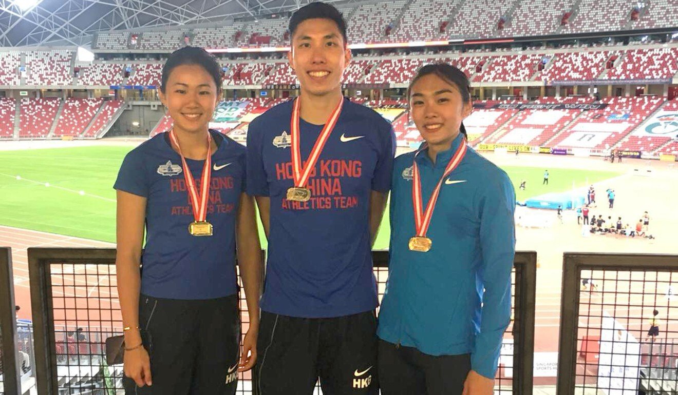 Cecilia Yeung (right) wins a gold medal at the 81st Singapore Open Track & Field Championships just before her injury in 2019. Photo: HKAAA