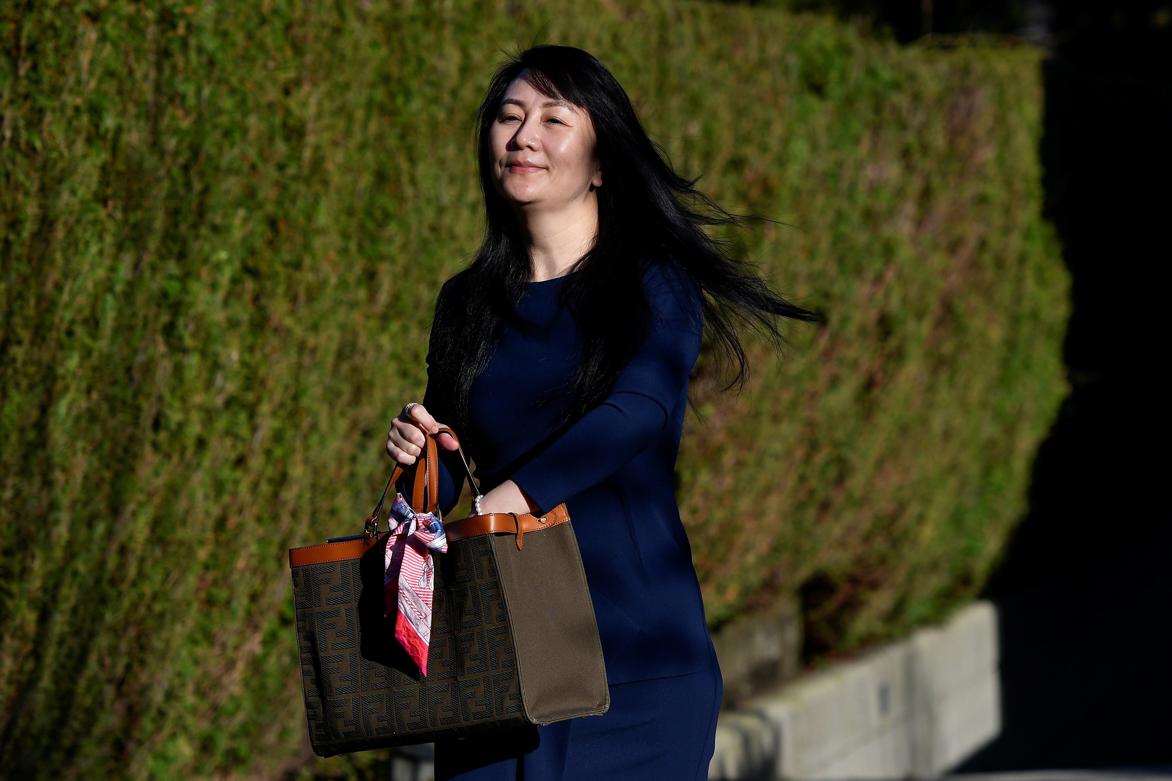 Huawei Technologies chief financial officer Meng Wanzhou leaving her home to attend a court hearing in Vancouver, British Columbia, on Monday. Photo: Reuters