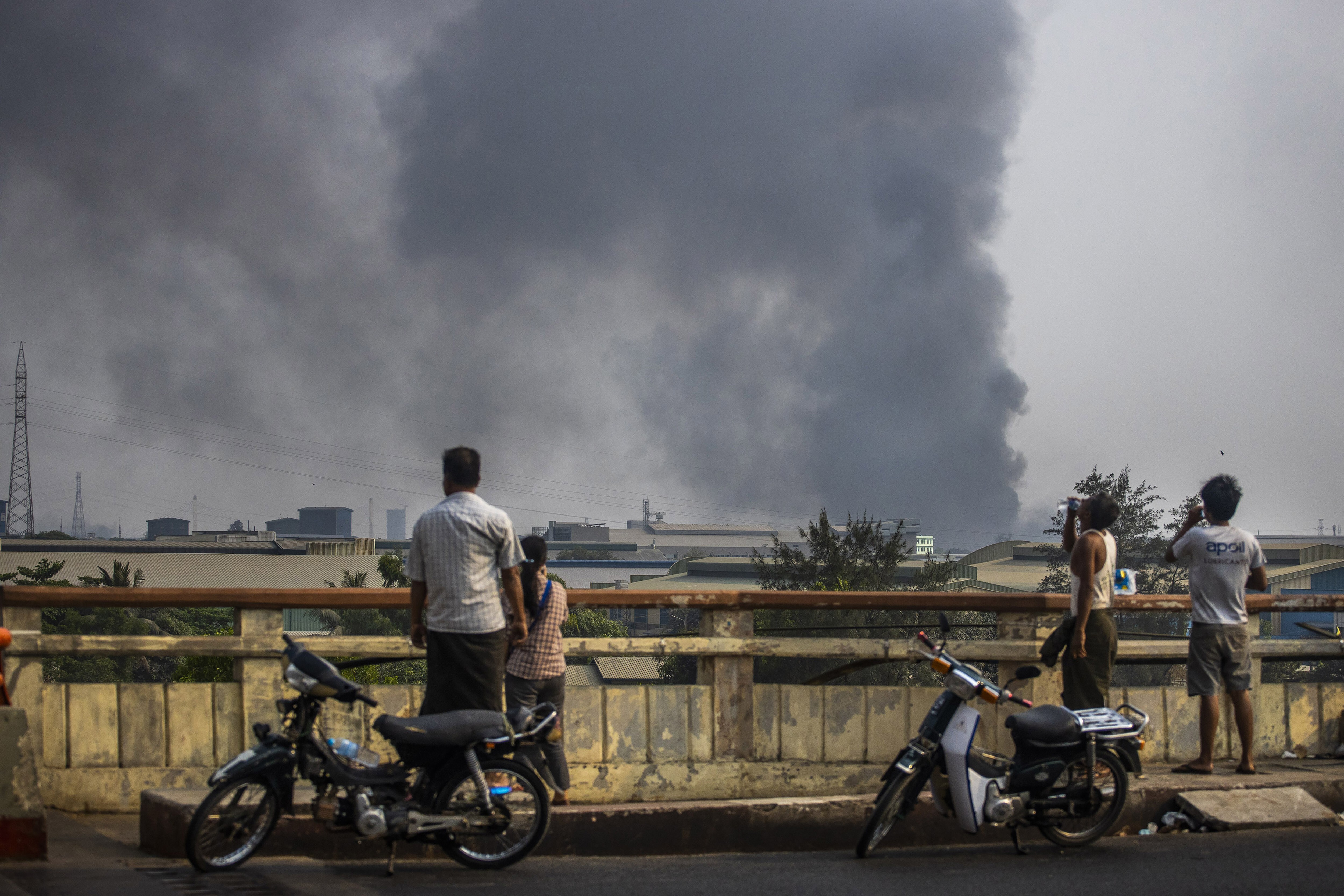 Black smoke billows from the industrial zone of Hlaingthaya township in Yangon. Photo: AP