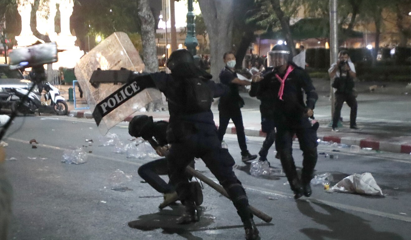 Clashes break out between police and protesters in front of the Grand Palace in Bangkok. Photo: AP