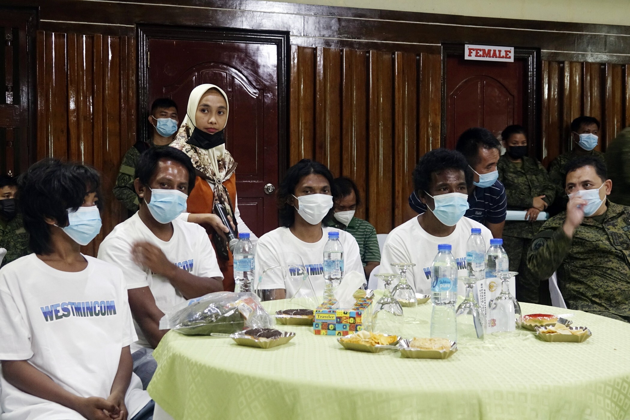 The kidnap victims attend a press conference at Western Mindanao Command headquarters in Zamboanga City, southern Philippines, on Sunday. Photo: EPA