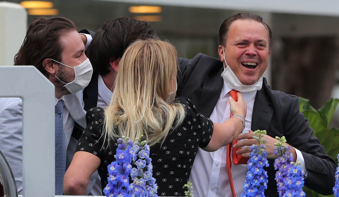 Caspar Fownes celebrates his BMW Hong Kong Derby win with his family.