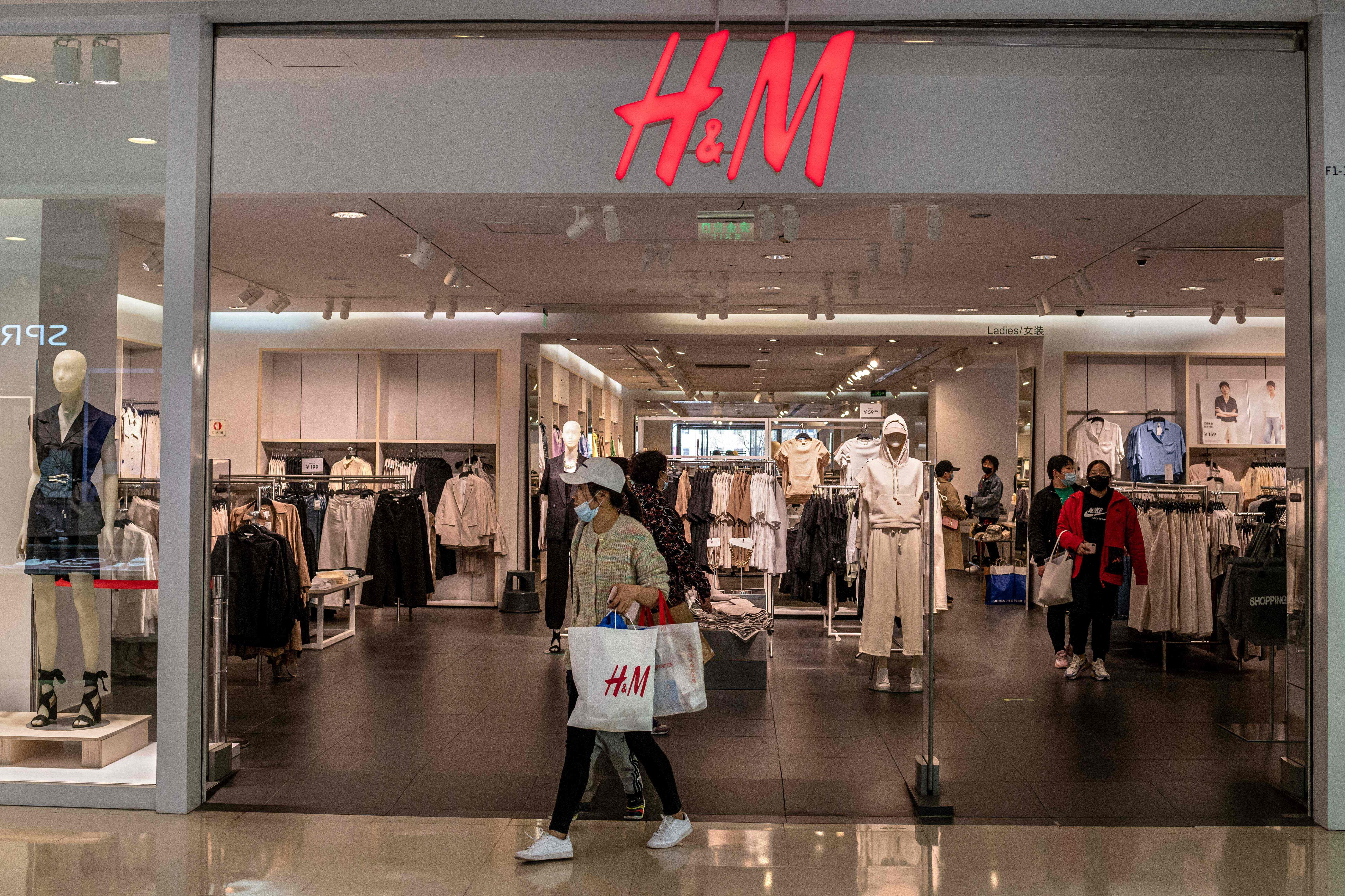 Shoppers visit Swedish clothing giant H&M in Beijing on March 25, 2021. Photo: AFP
