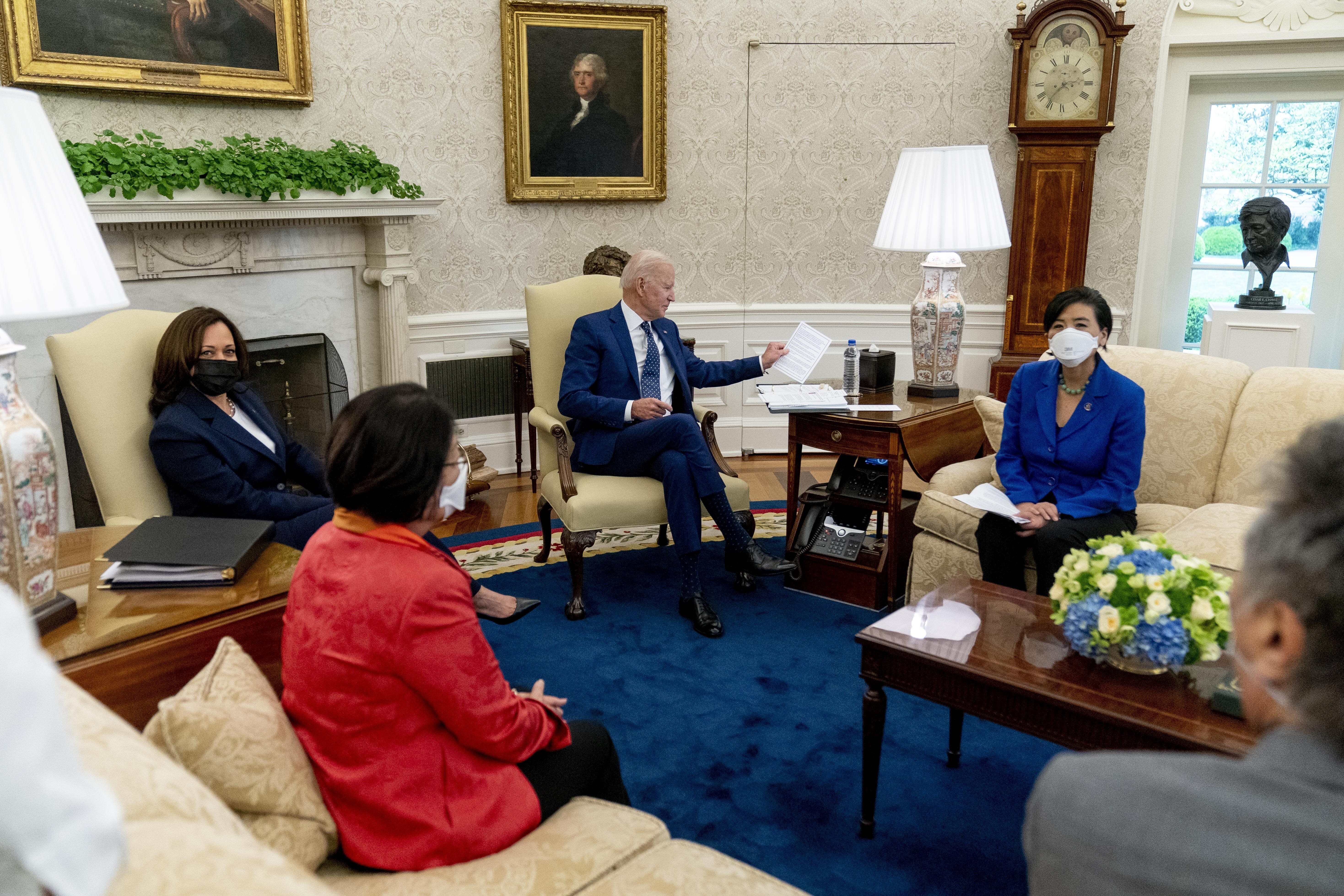 President Joe Biden and Vice-President Kamala Harris meet Senator Mazie Hirono (left), Representative Judy Chu, and other members of the Congressional Asian Pacific American Caucus Executive Committee in the Oval Office at the White House in Washington, on April 15. Photo: AP