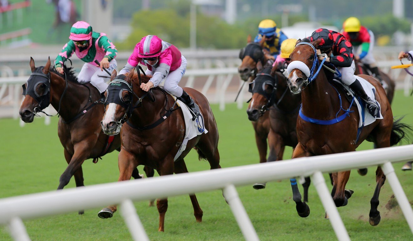 Zac Purton pushes Ka Ying Spirit (middle) to victory on Sunday.