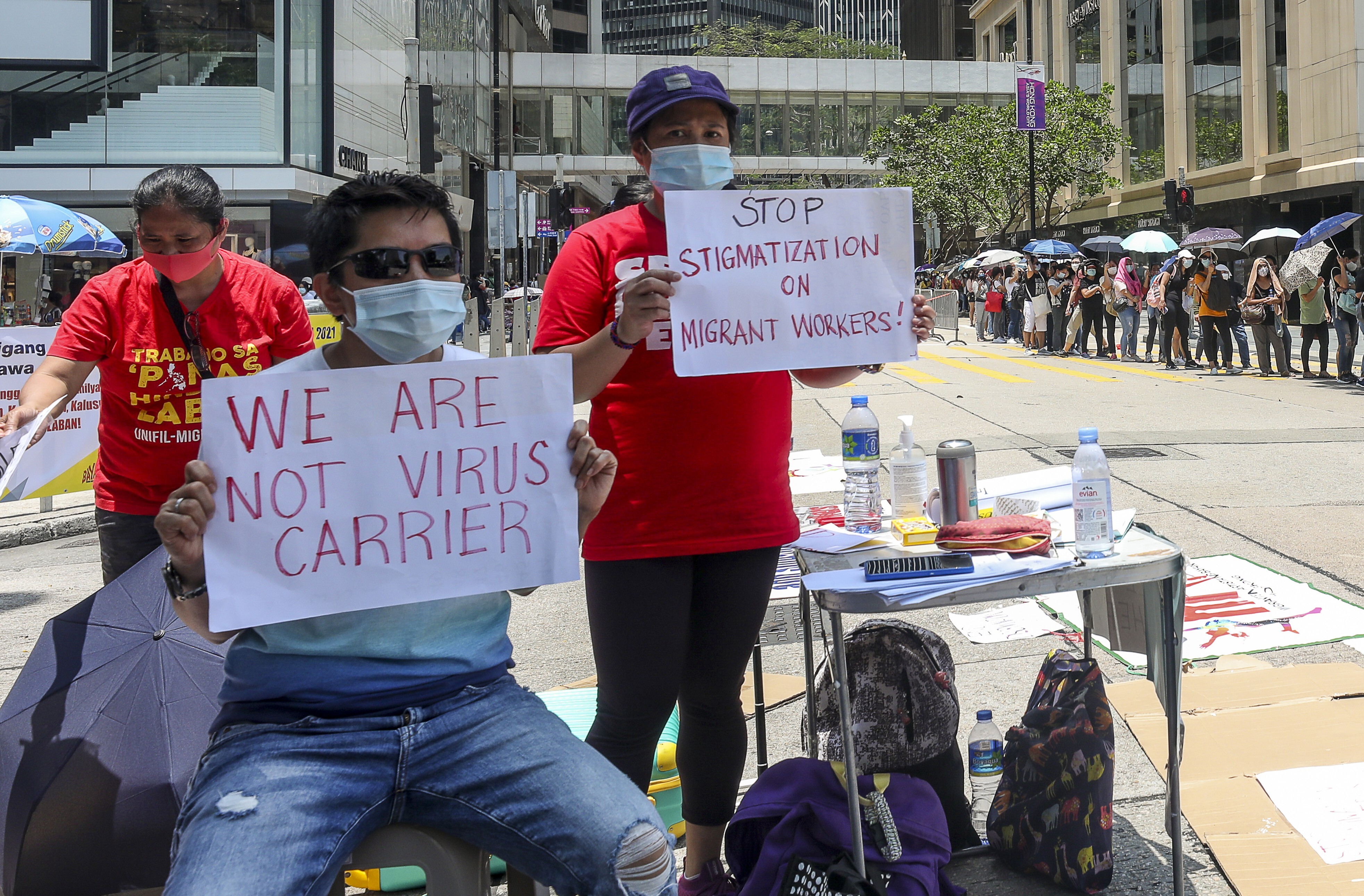 Foreign domestic helpers petition against the new rules mandating blanket Covid-19 testing and vaccinations on Chater Road in Central, Hong Kong, on May 1. Photo: Xiaomei Chen