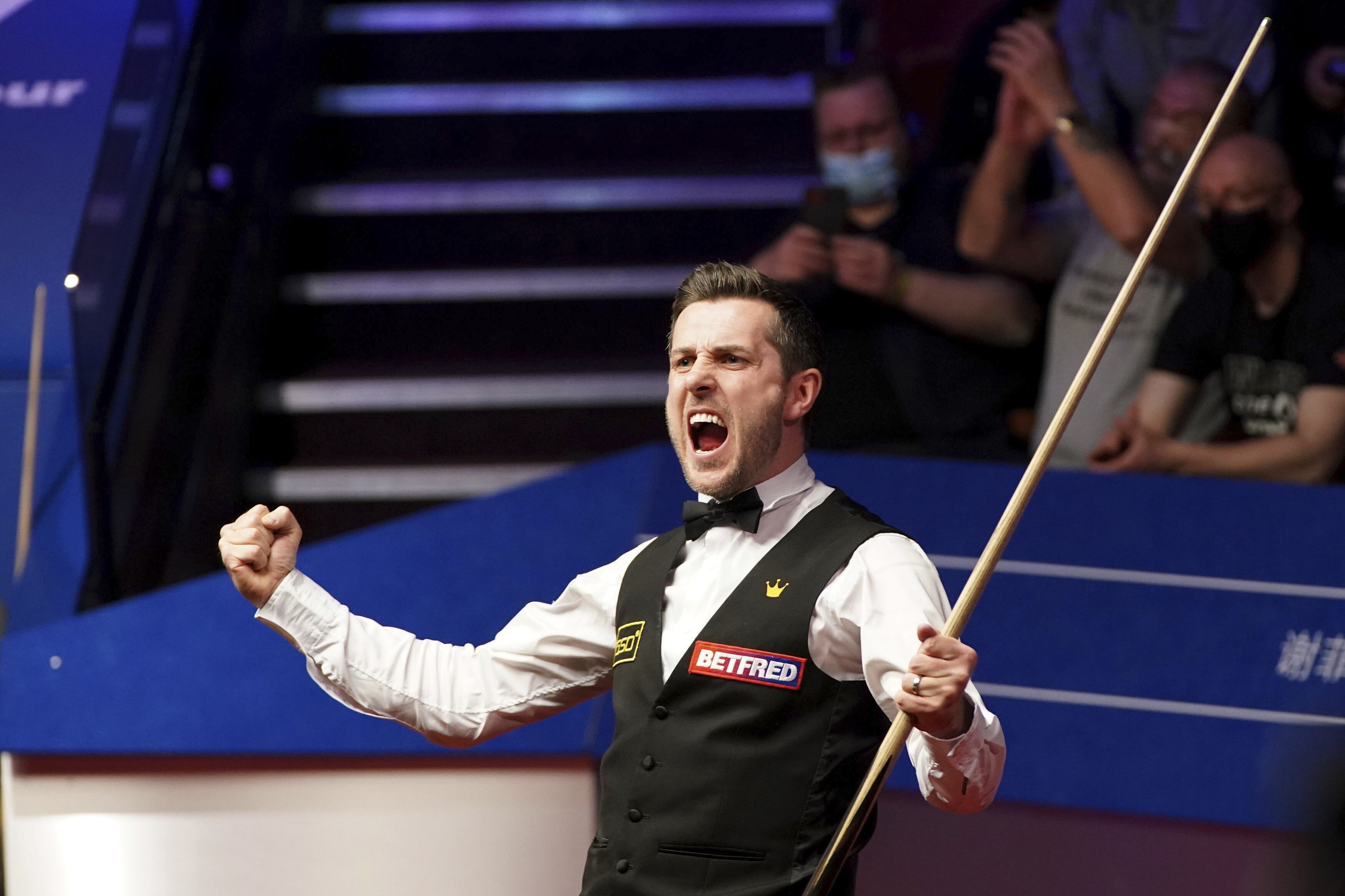 England’s Mark Selby celebrates winning the World Snooker Championships at the Crucible Theatre in Sheffield. Photo: AP