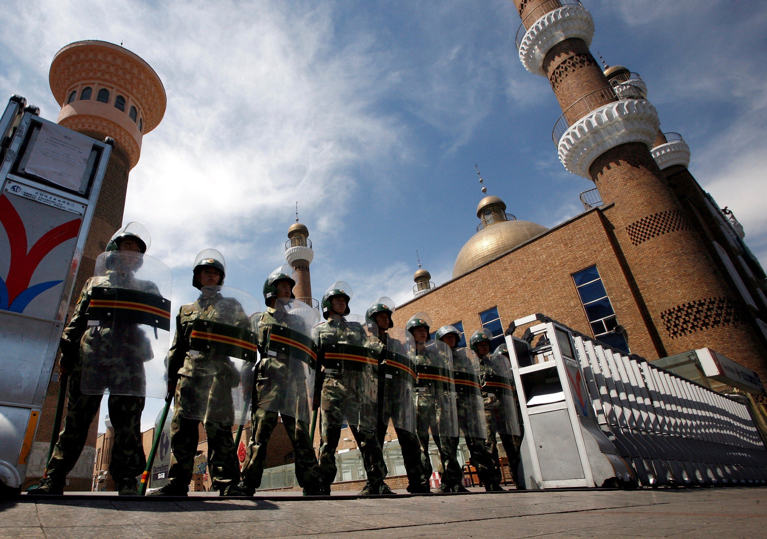 Chinese paramilitary police in riot gear outside a mosque in Urumqi, the capital of Xinjiang. Photo: Reuters
