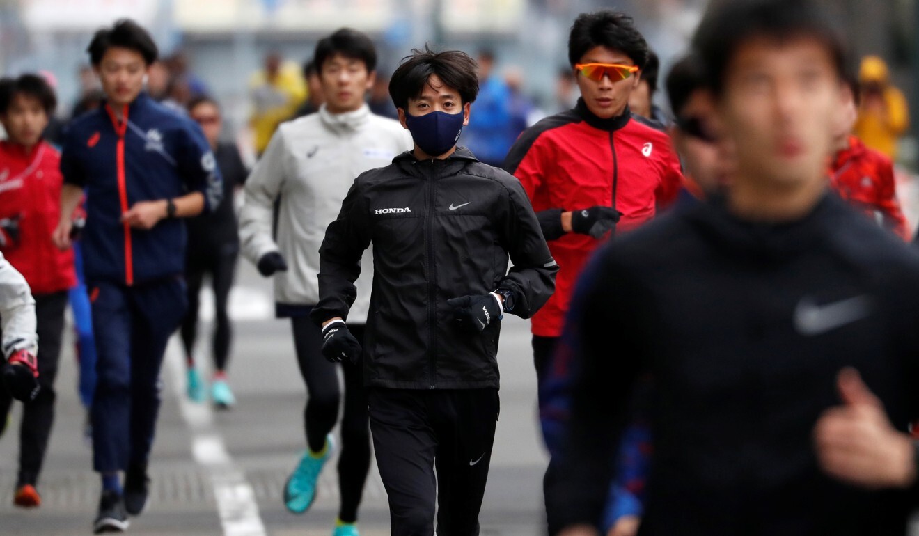 Runners warm up before the start of the Hokkaido-Sapporo Marathon Festival 2021 in Sapporo, Hokkaido. Photo: Reuters