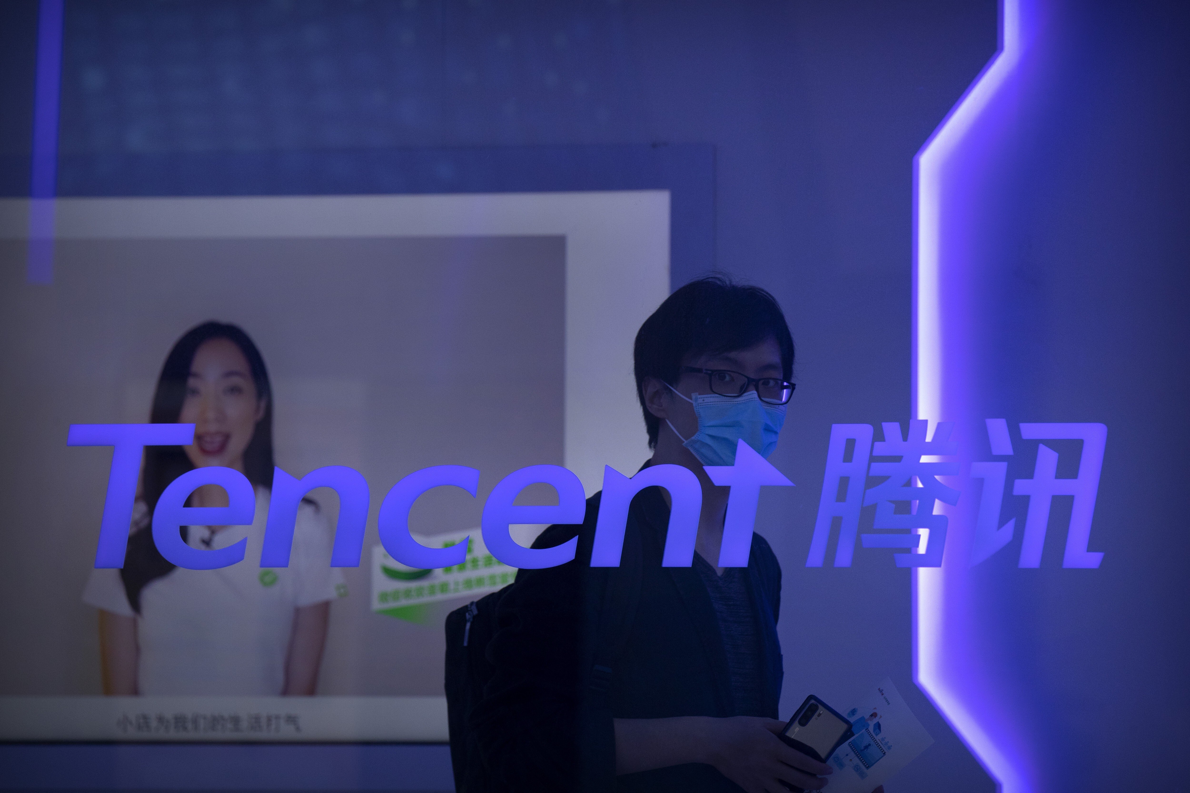 A visitor walks past a logo for Tencent at the company’s display at the China International Fair for Trade in Services in Beijing, China, on September 5, 2020. Photo: AP Photo