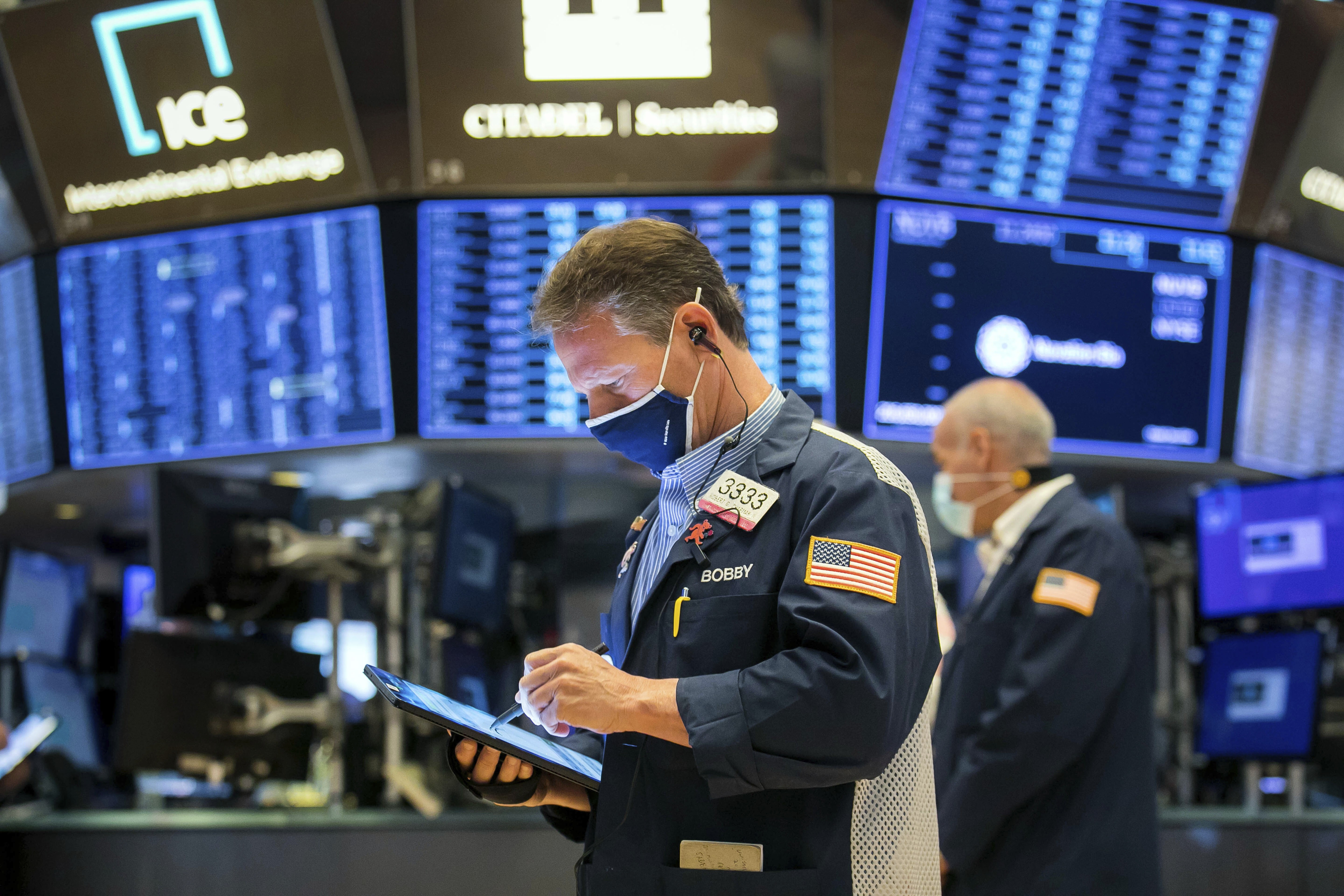 Traders work on the floor of the New York Stock Exchange on April 26. Investors are right to fret over tax increases reducing corporate profits, impinging on equity returns in the coming year. Photo: AP