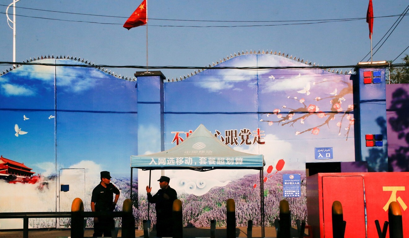 Security guards stand at the gates of a ‘vocational skills education centre’ in Xinjiang in 2018. Photo: Reuters