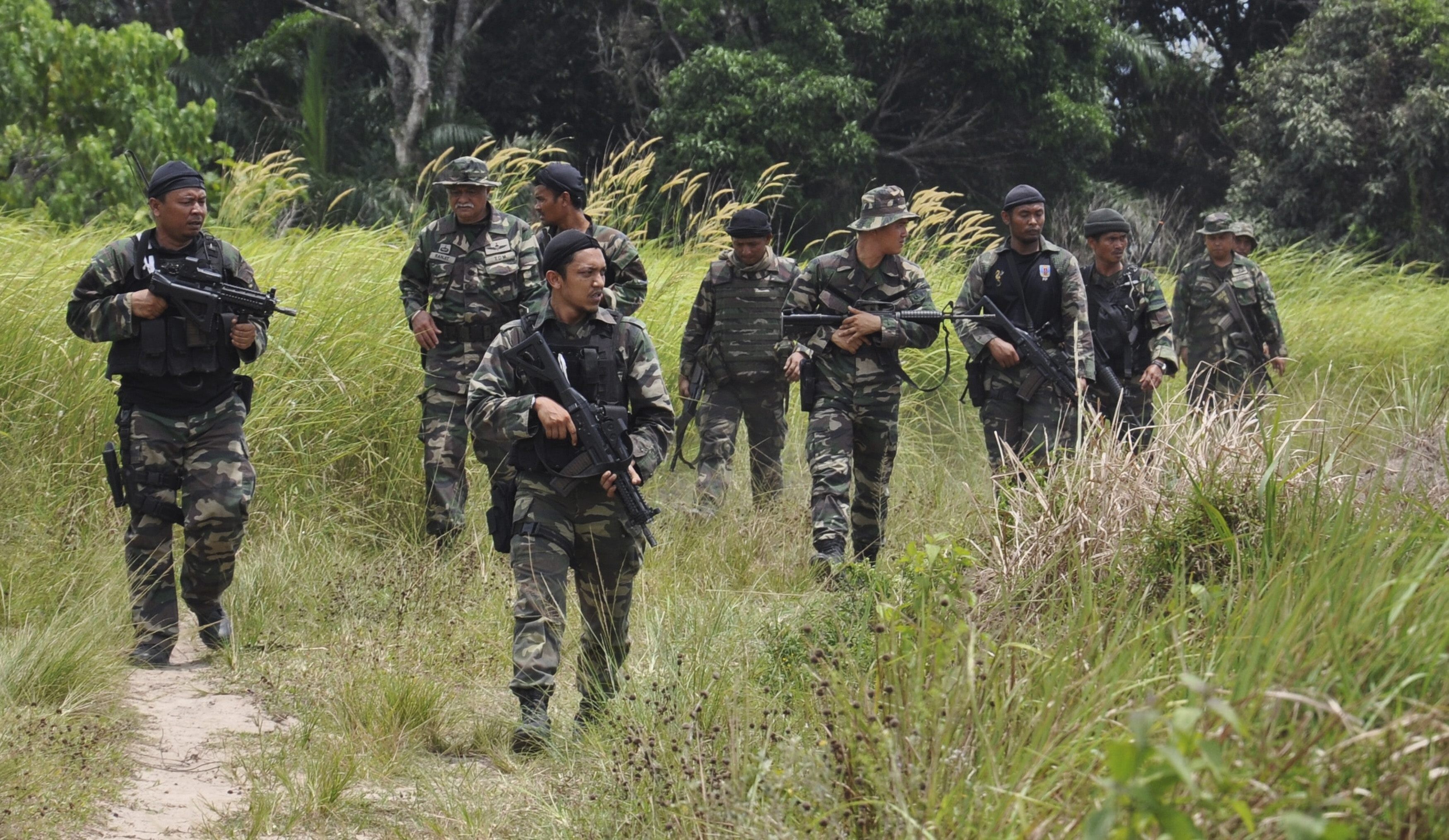 Malaysian soldiers seen on patrol during an operation in Sabah state. Photo: Handout via EPA