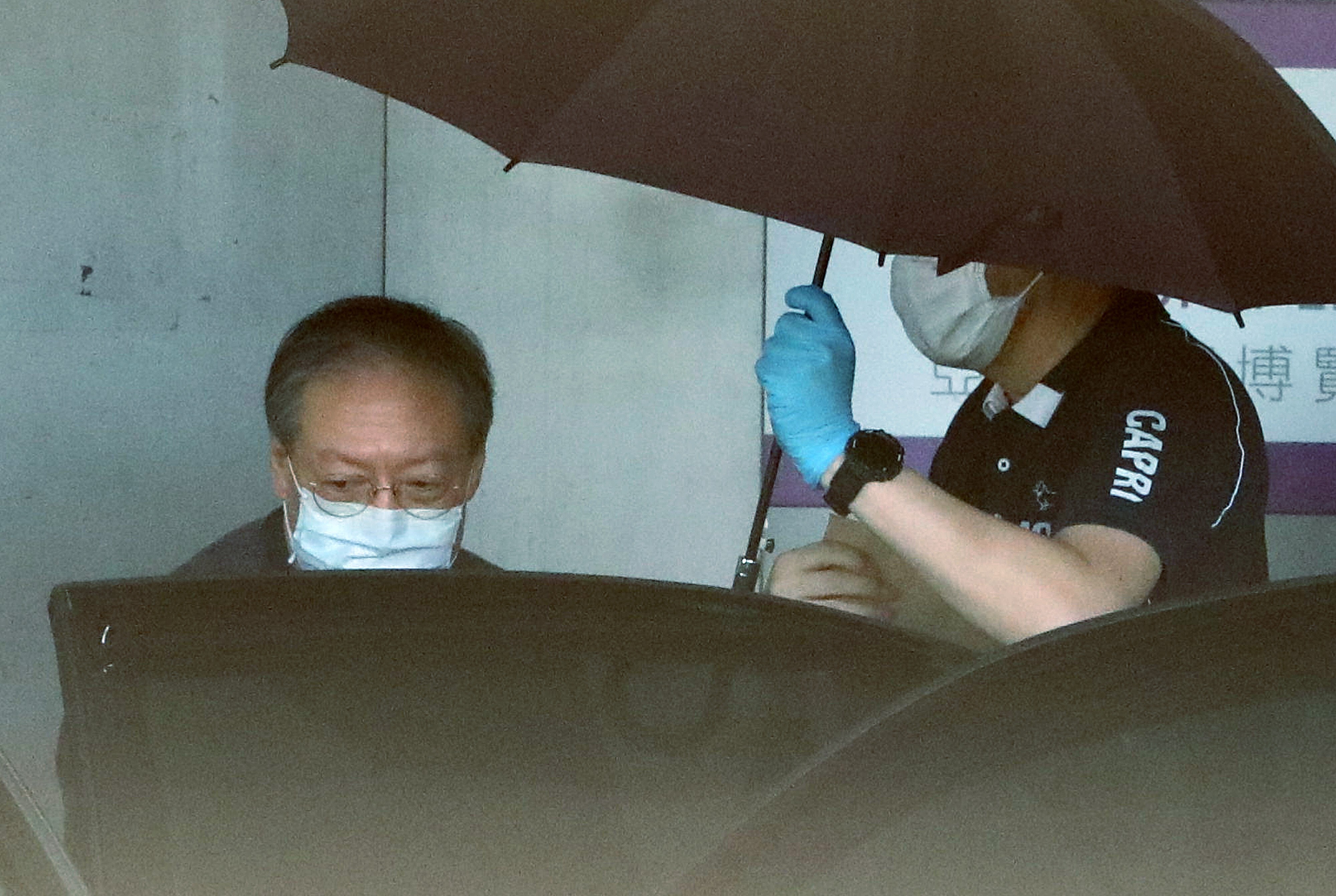Former Hong Kong home affairs minister Patrick Ho leaves AsiaWorld-Expo after a coronavirus test upon his return to the city last June. Photo: May Tse