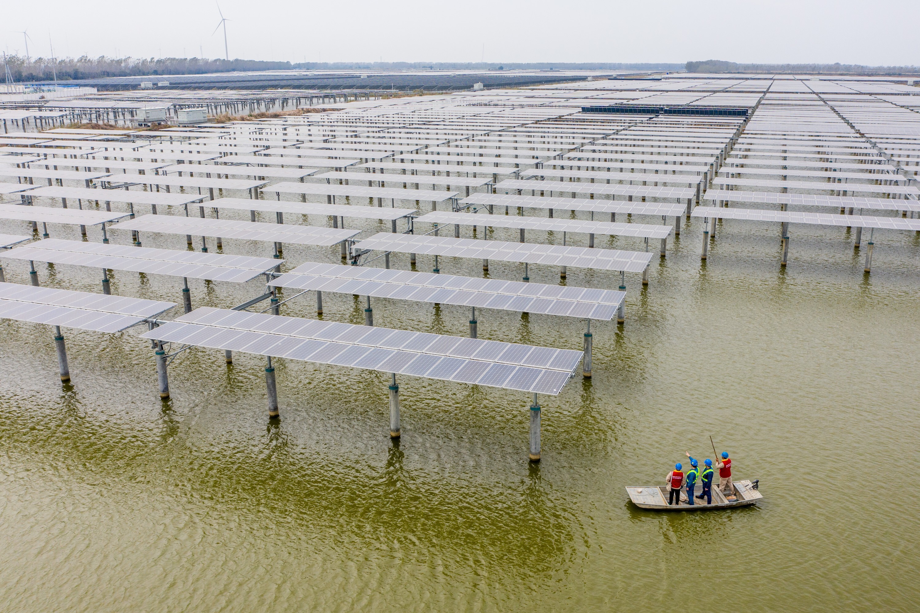 Electricians check photovoltaic solar panels in Sheyanghu, Jiangsu province, on November 5, 2020. Photo: Xinhua