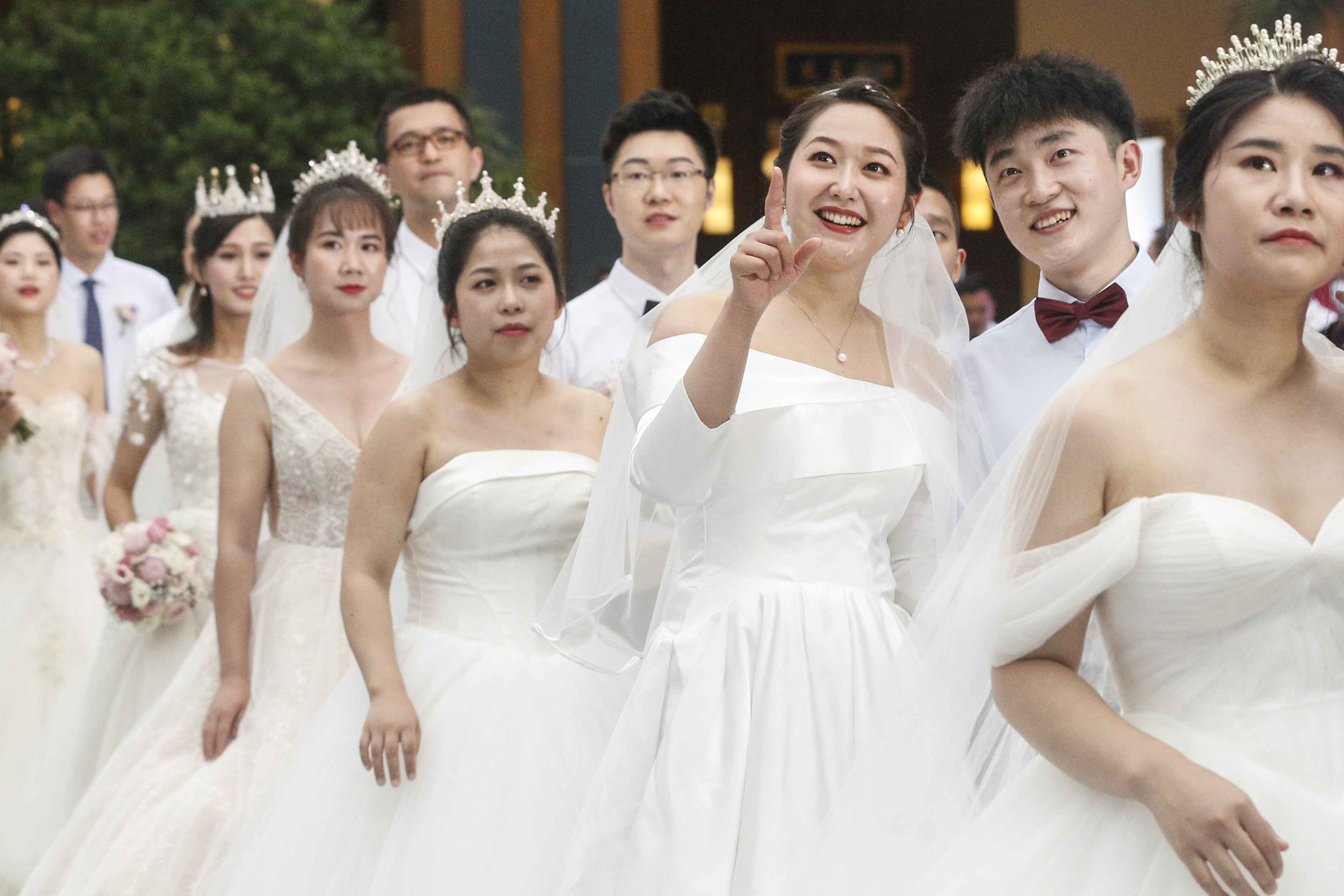Couples get ready to attend a group wedding ceremony in Boao, Hainan province, on June 6, 2020. Some Chinese feminists reject the institution of marriage, which they regard as the root of patriarchy. Photo: Xinhua