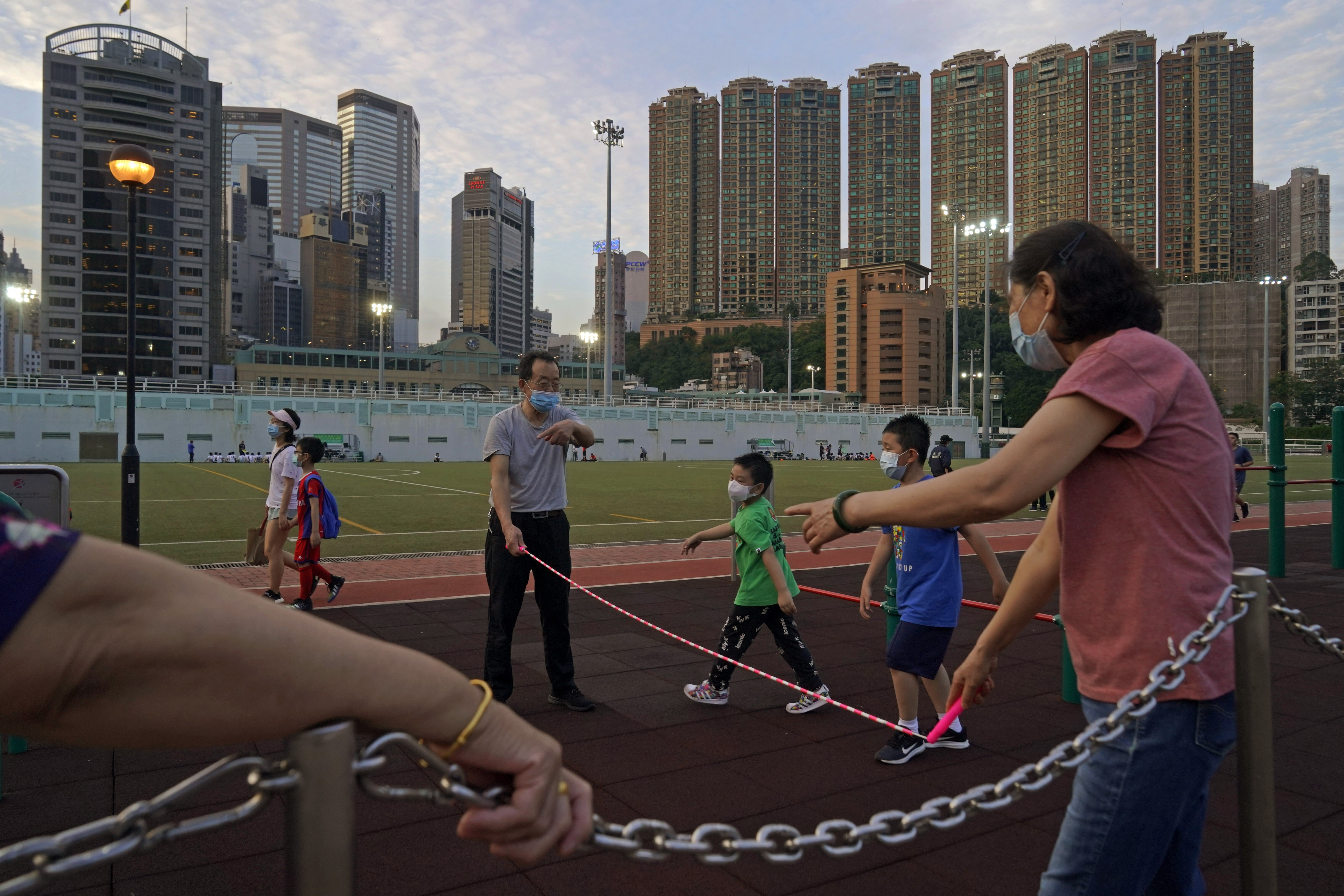 People spend time in a Hong Kong park on April 30. Diplomats in both China and Britain should lobby for Hong Kong to be included in the UK’s green list of quarantine-free travel. Photo: AP