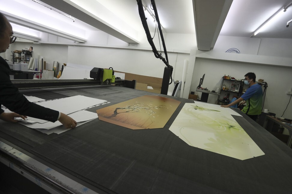 The shaping and sanitisation procedure used for the cardboard coffins at LifeArt. Photo: Jonathan Wong