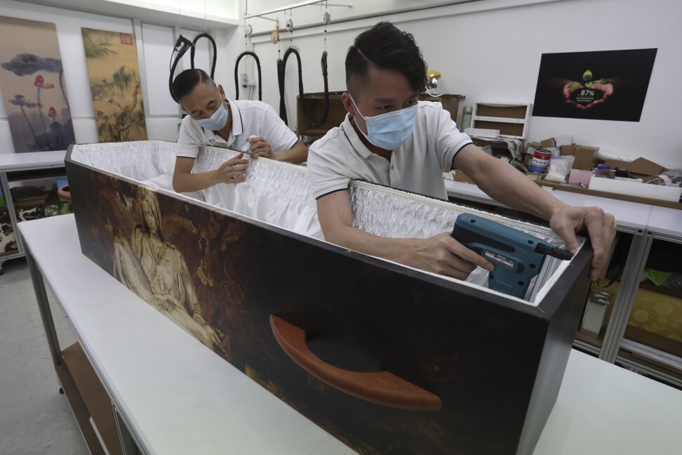 Workers at LifeArt assemble a cardboard coffin at its plant in Aberdeen, Hong Kong. Photo: Jonathan Wong