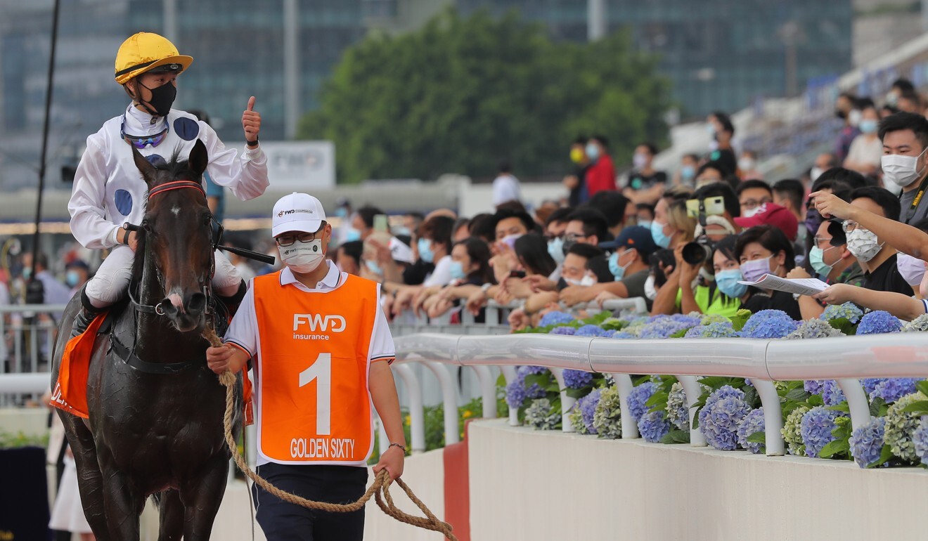 Vincent Ho gives fans the thumbs up after Golden Sixty’s win in the Champions Mile.