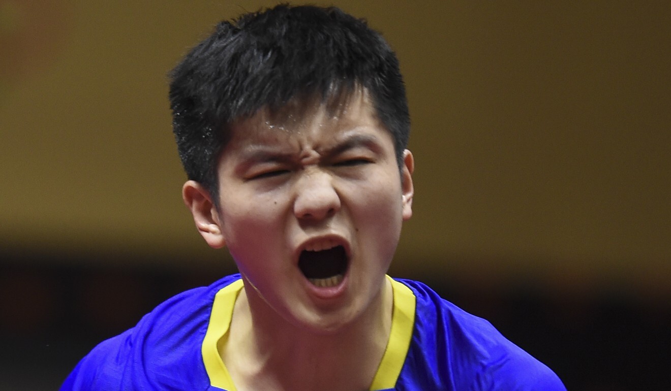 Fan Zhendong celebrates a point against England’s Liam Pitchford at the 2020 ITTF Qatar Open. Photo: Xinhua