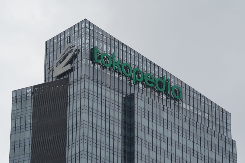 The Tokopedia logo atop the company's building in Jakarta. The combined GoTo claims to have more than 100 million monthly average users. Photo: Bloomberg