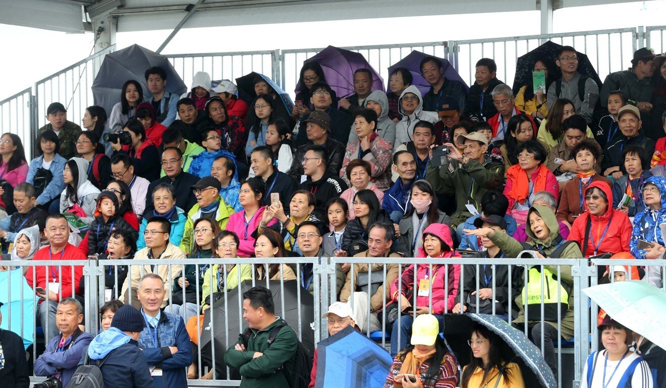 Chinese racing fans watch the Conghua races in 2019 from temporary stands.