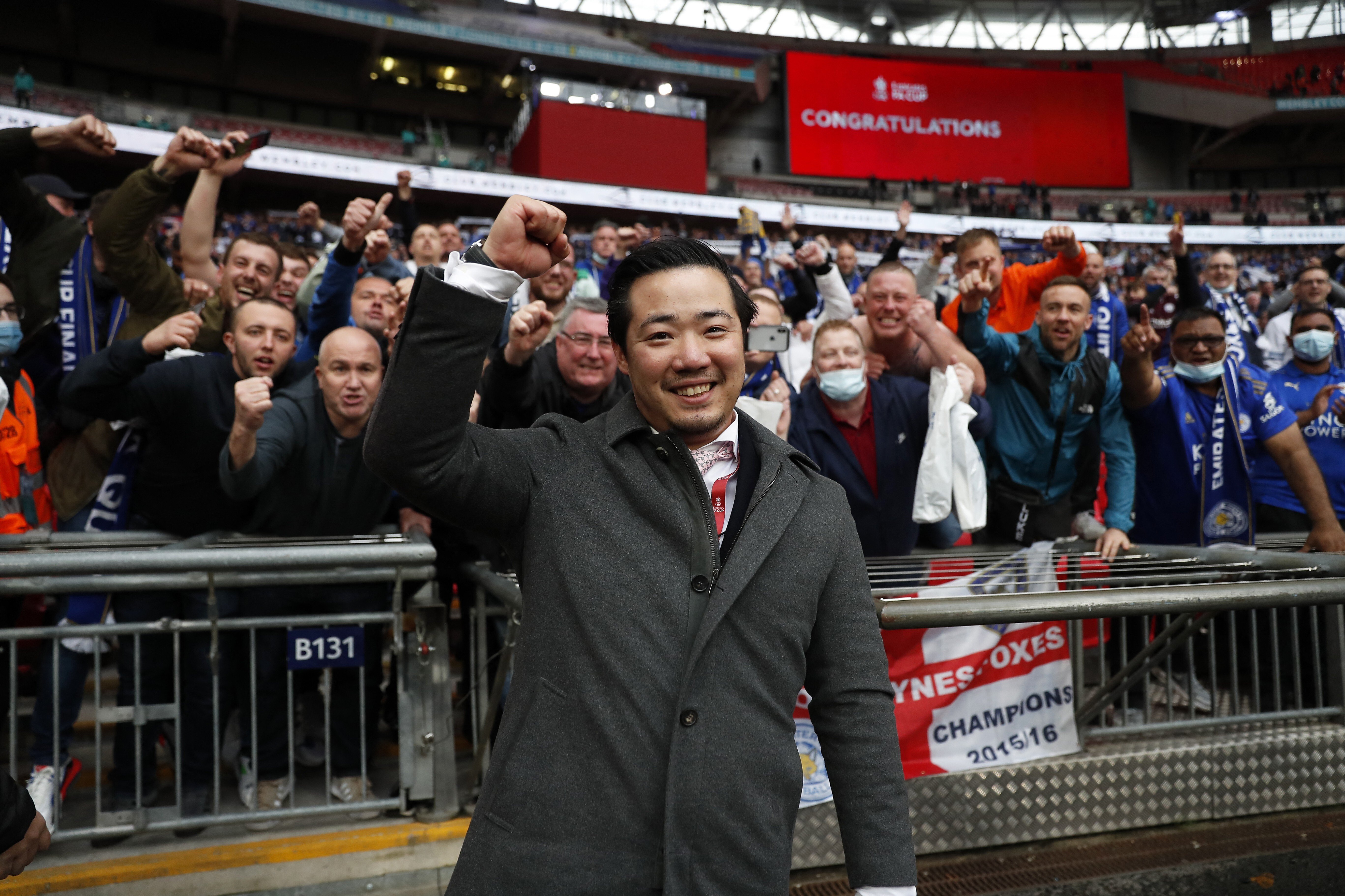 Leicester City’s chairman Aiyawatt Srivaddhanaprabha celebrates with fans after the club defeated Chelsea to win the FA Cup. Photo: AFP