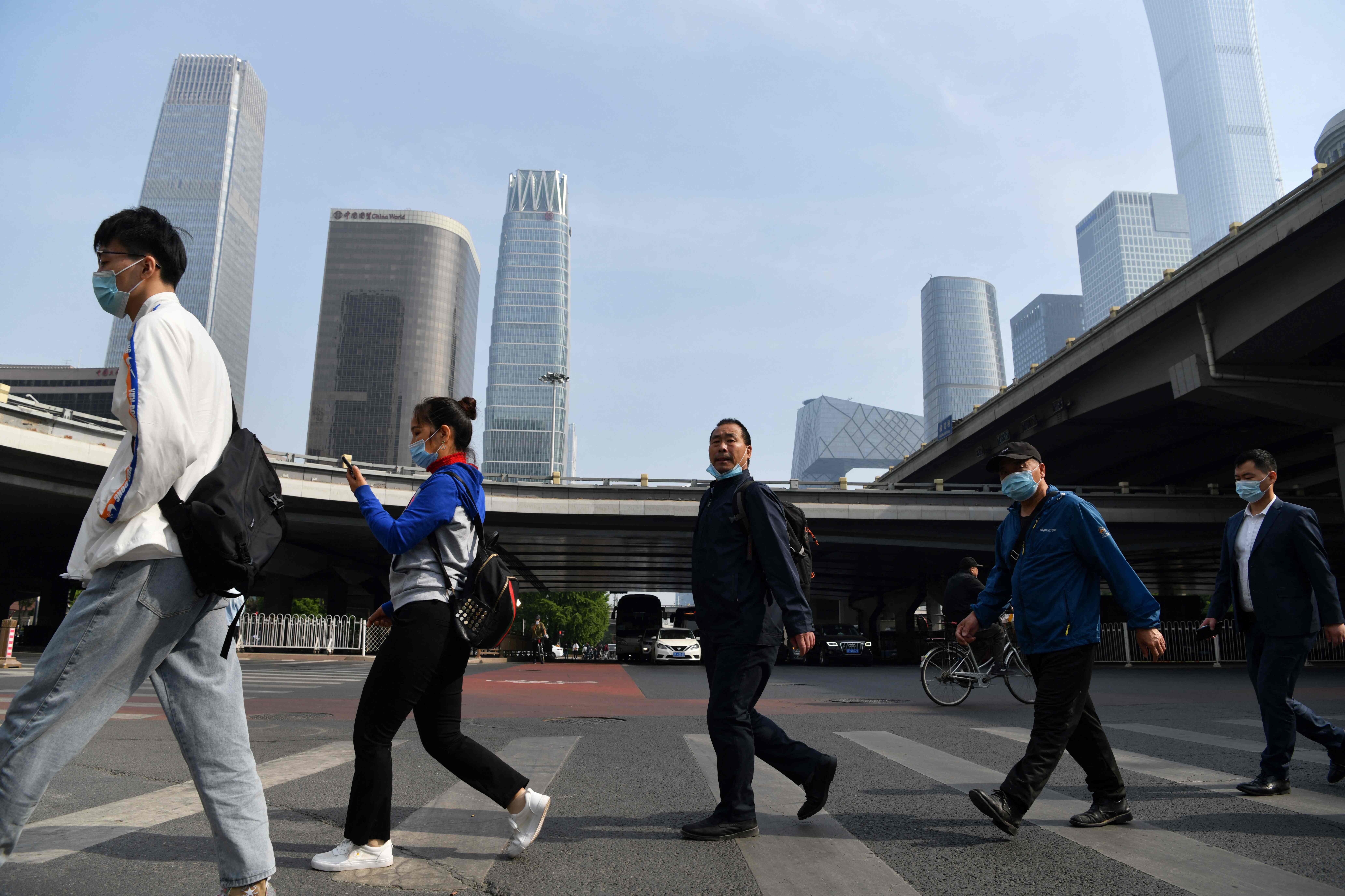 The survey found 87 per cent of respondents in mainland China were happy with the state of the economy, which grew 2.3 per cent last year. Photo: AFP