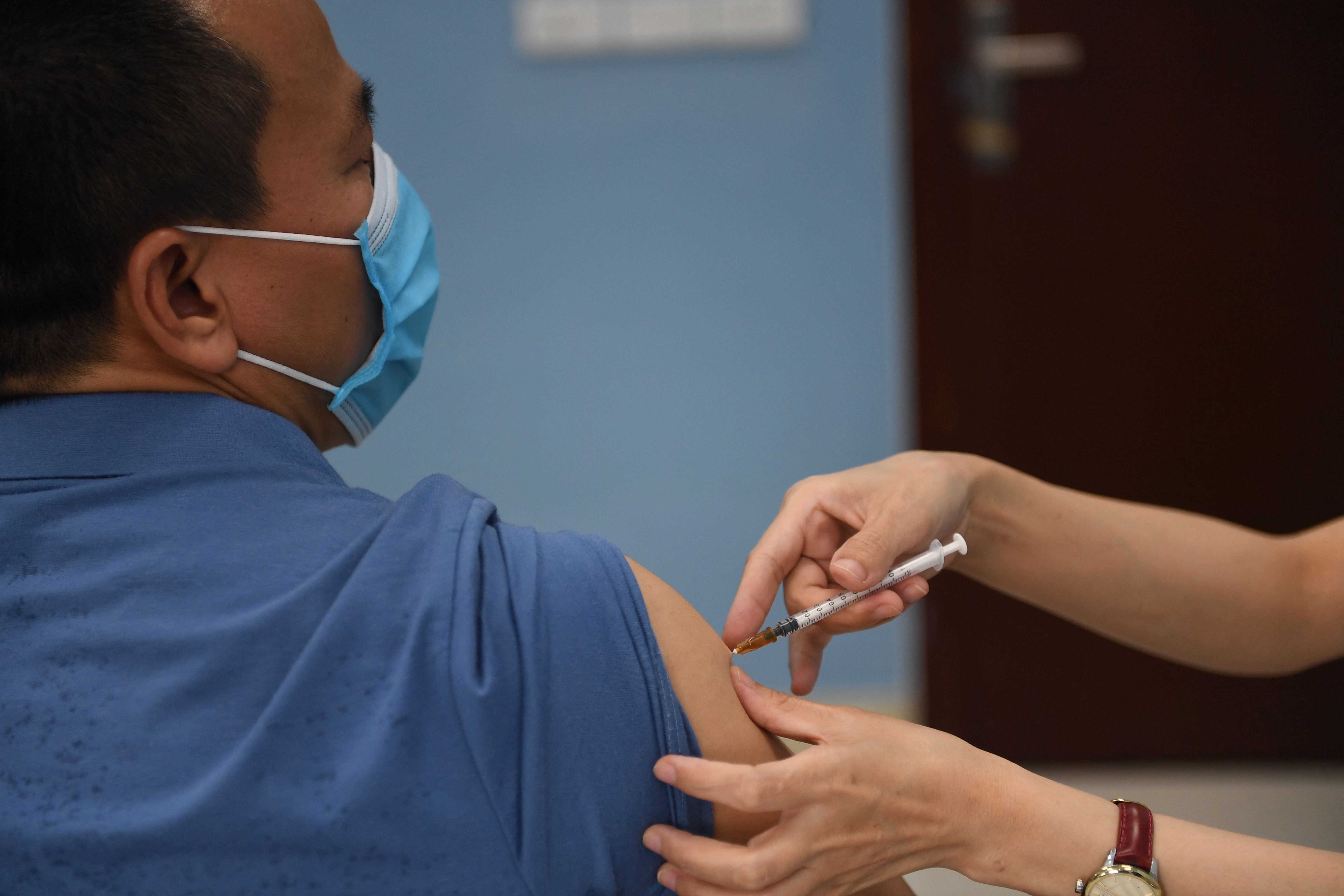 A health worker administers a dose of the AstraZeneca Covid-19 vaccine at a hospital in Hanoi this week. Photo: AFP