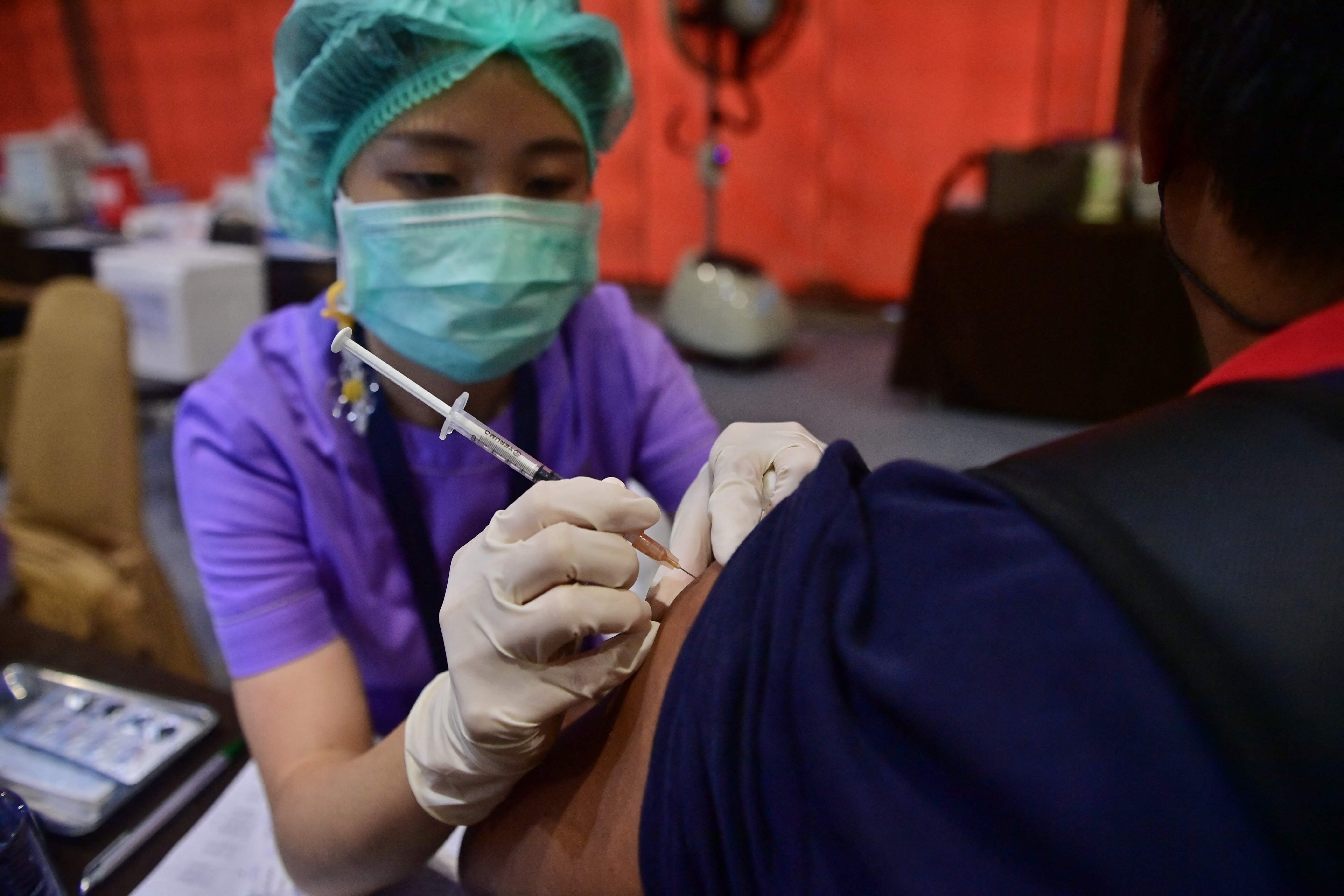 A health care worker administers a coronavirus vaccine in Bangkok. Photo: AFP