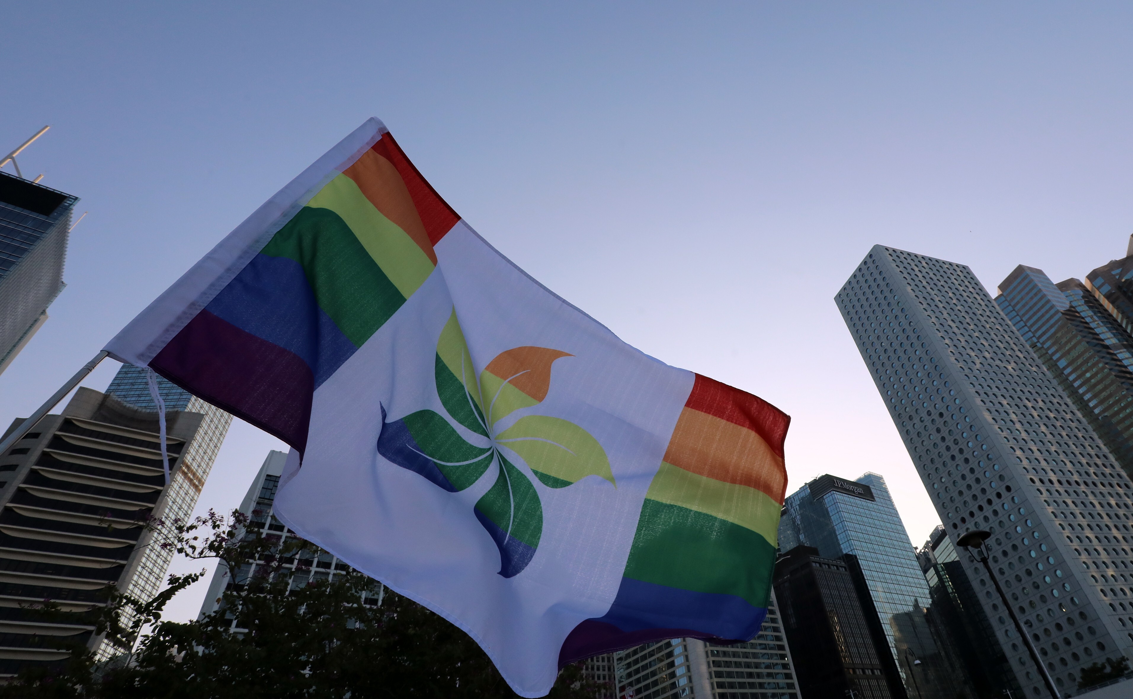 A Hong Kong flag in rainbow colours flies during the Pride Parade rally in Central in November 2019. Photo: Felix Wong