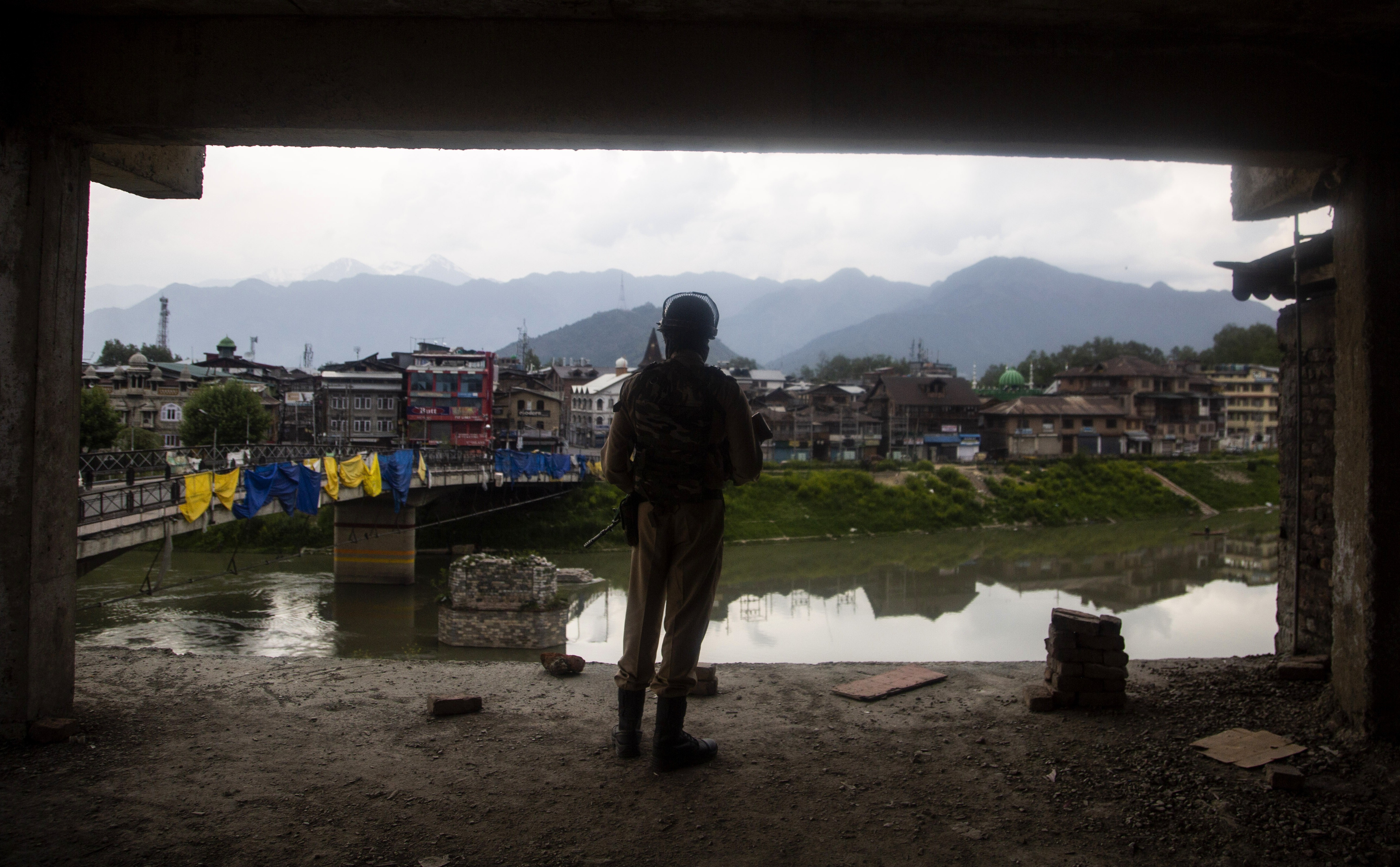 A paramilitary soldier keeps a vigil from inside a building under construction in Srinagar, Indian-administered Kashmir, in April. Photo: AP