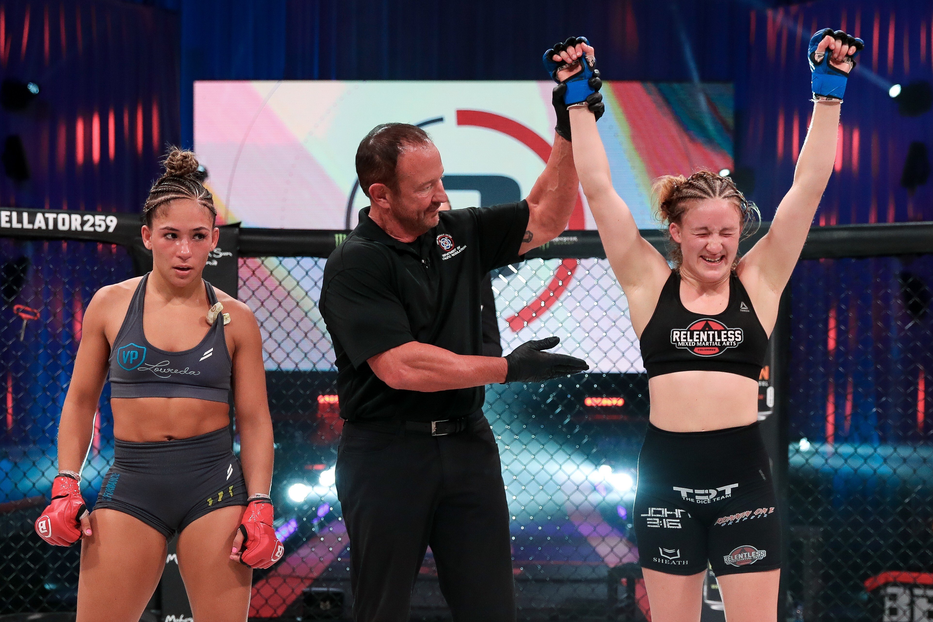 Hannah Guy’s arm is raised after earning a unanimous decision against Valerie Loureda at Bellator 259. Photos: Bellator MMA