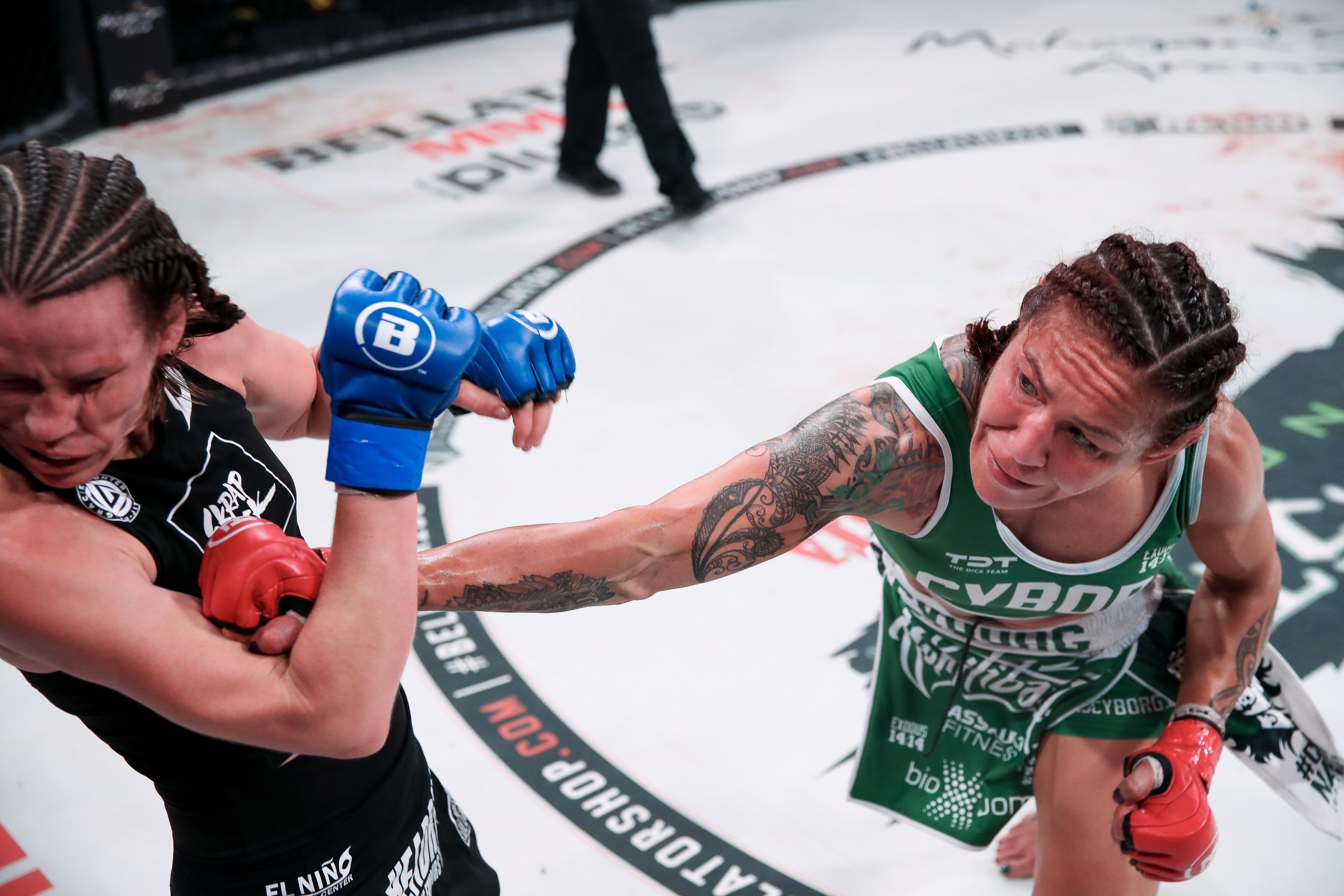Cris Cyborg drops Leslie Smith late in the fifth round at Bellator 259. Photos: Bellator MMA
