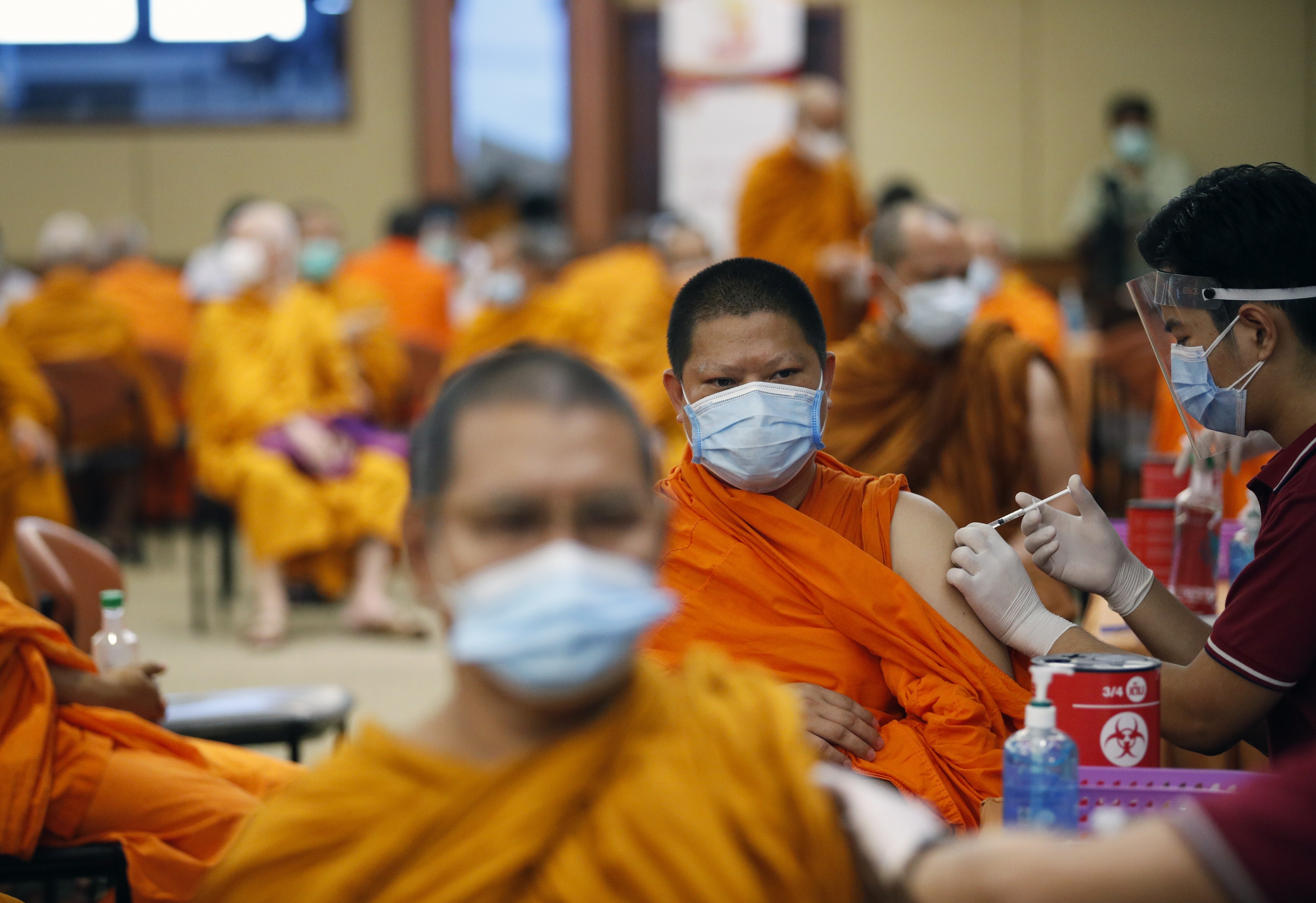 Buddhist monks in Bangkok, Thailand, get a shot of the Sinovac vaccine. Photo: EPA