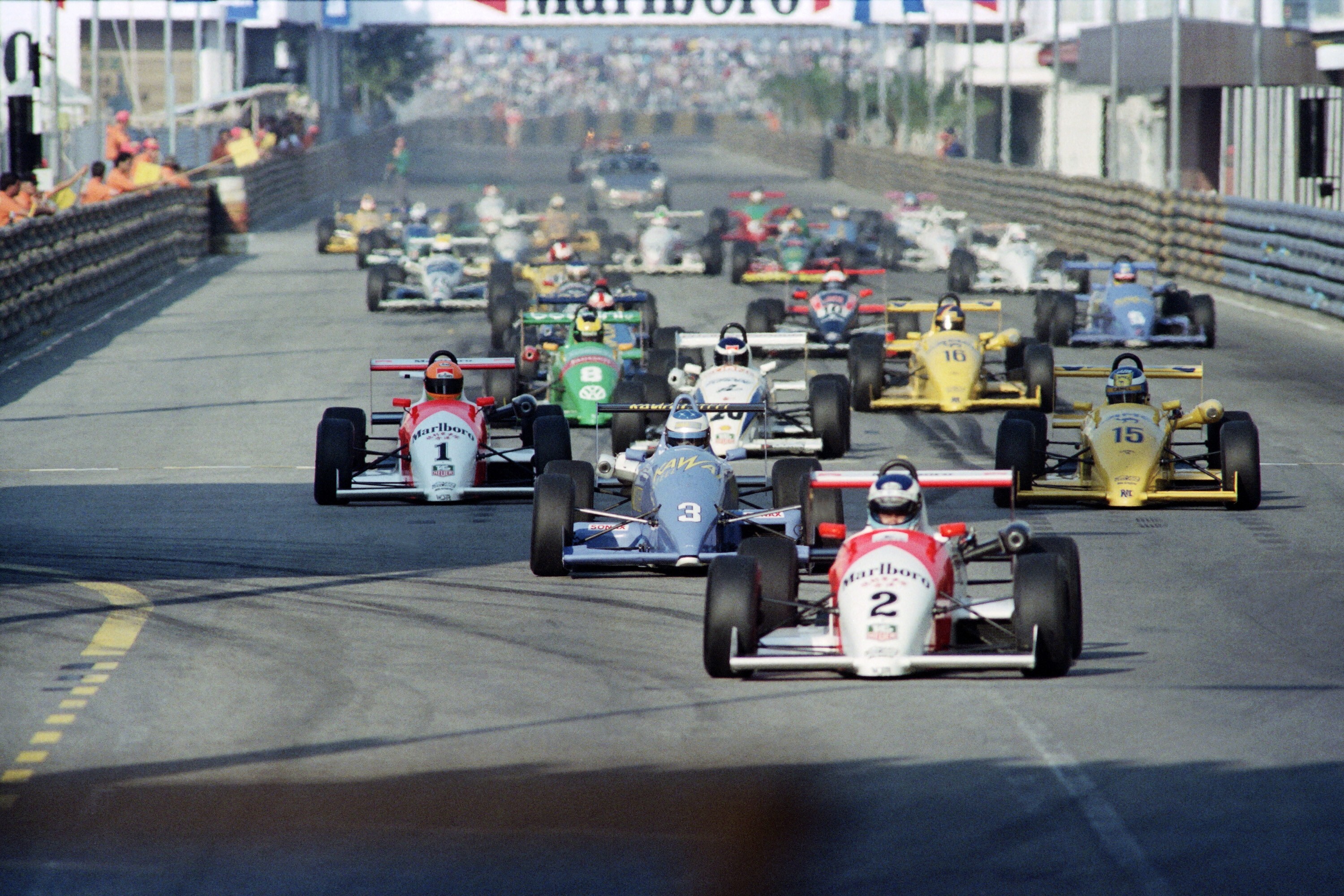 Michael Schumacher (blue car in second place) and Mika Hakkinen (red car at front) during the Macau F3 Grand Prix in 1990. Photo: Mandel Ngan/AFP