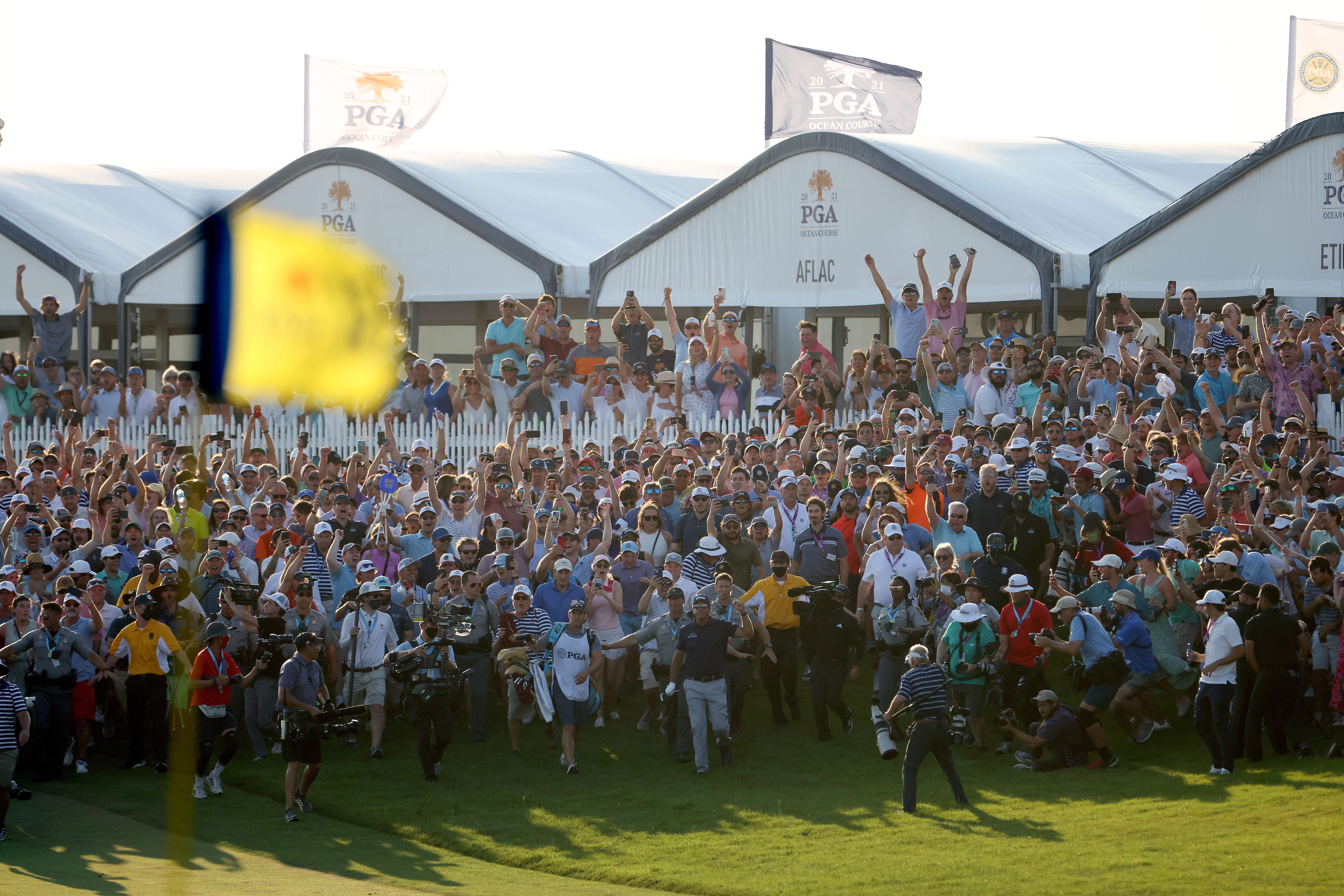 Phil Mickelson walks up the 18th fairway followed by a massive crowd at the conclusion of the 2021 PGA Championship. Photo: AFP