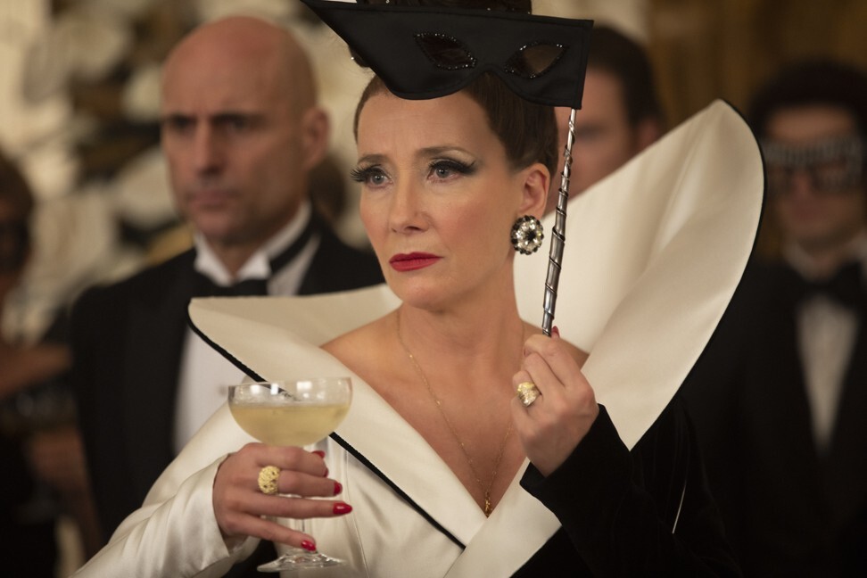 Thompson (front) as the Baroness and Mark Strong (left) as John the Valet in a still from Cruella. Photo: Laurie Sparham/Disney Enterprises, Inc