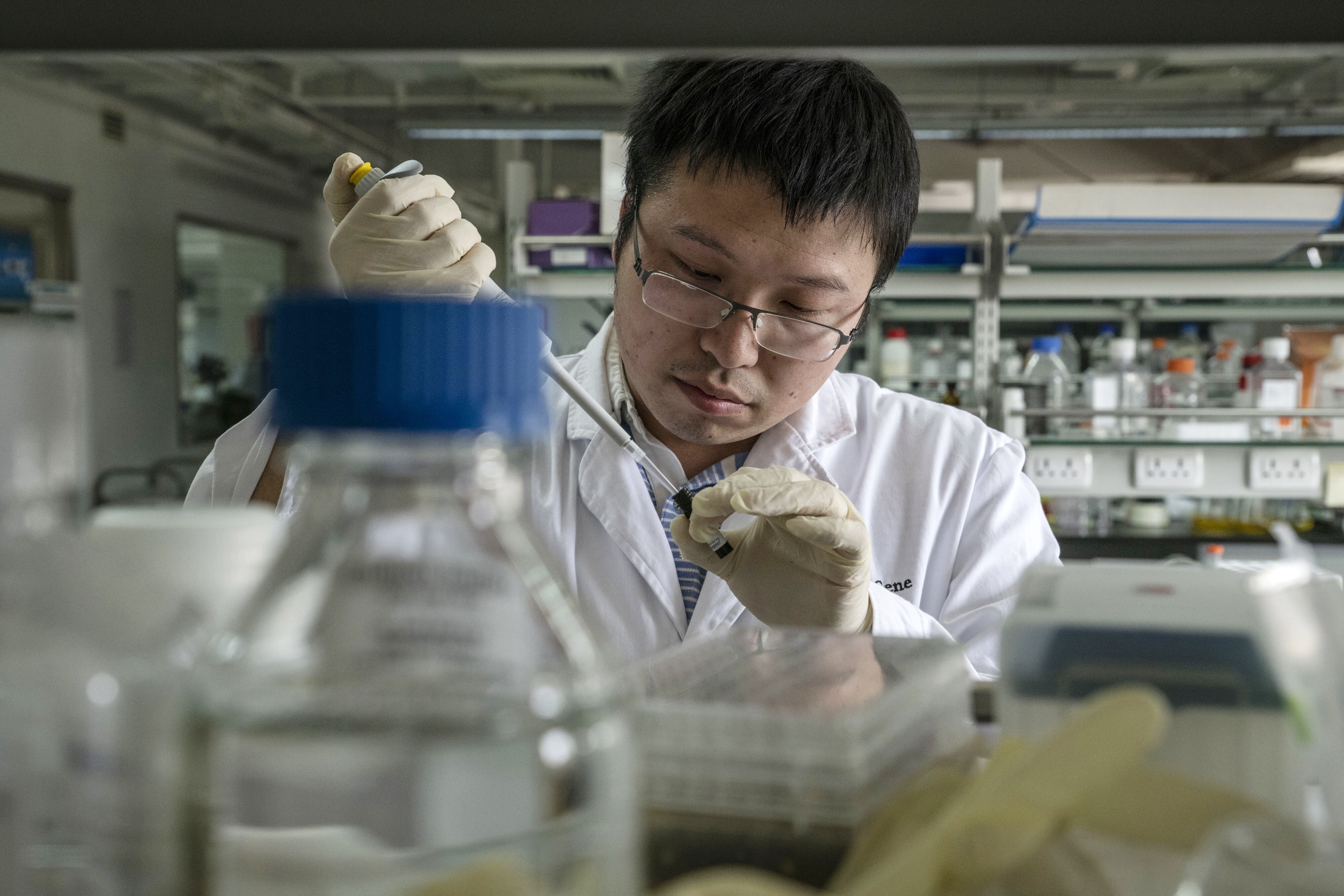A researcher prepares a sample inside a laboratory at BeiGene Ltd’s research and development centre in Beijing on May 24, 2018. The company made its Hong Kong trading debut in August 2018. Photo: Bloomberg