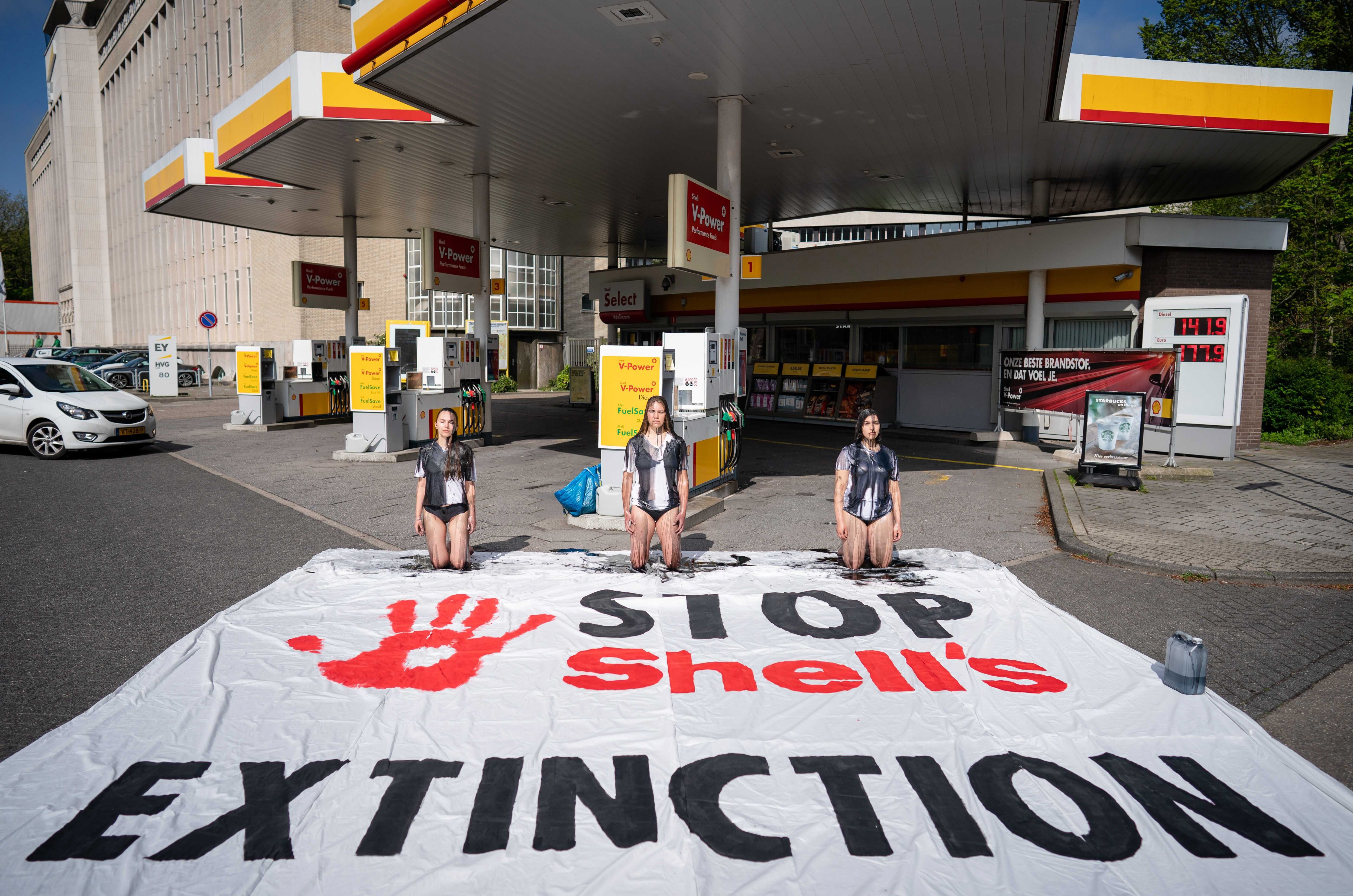 Environmentalists protest at a Shell gas station in The Hague, Netherlands. Photo: EPA-EFE