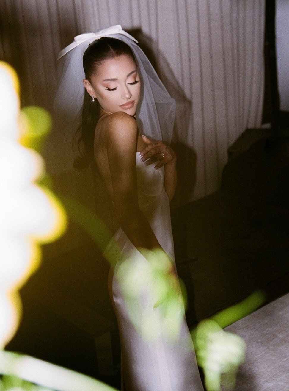 Grande’s dress was described as ‘a custom lily-white silk charmeuse empire waist column gown’. Photo: Stefan Kohli/Instagram