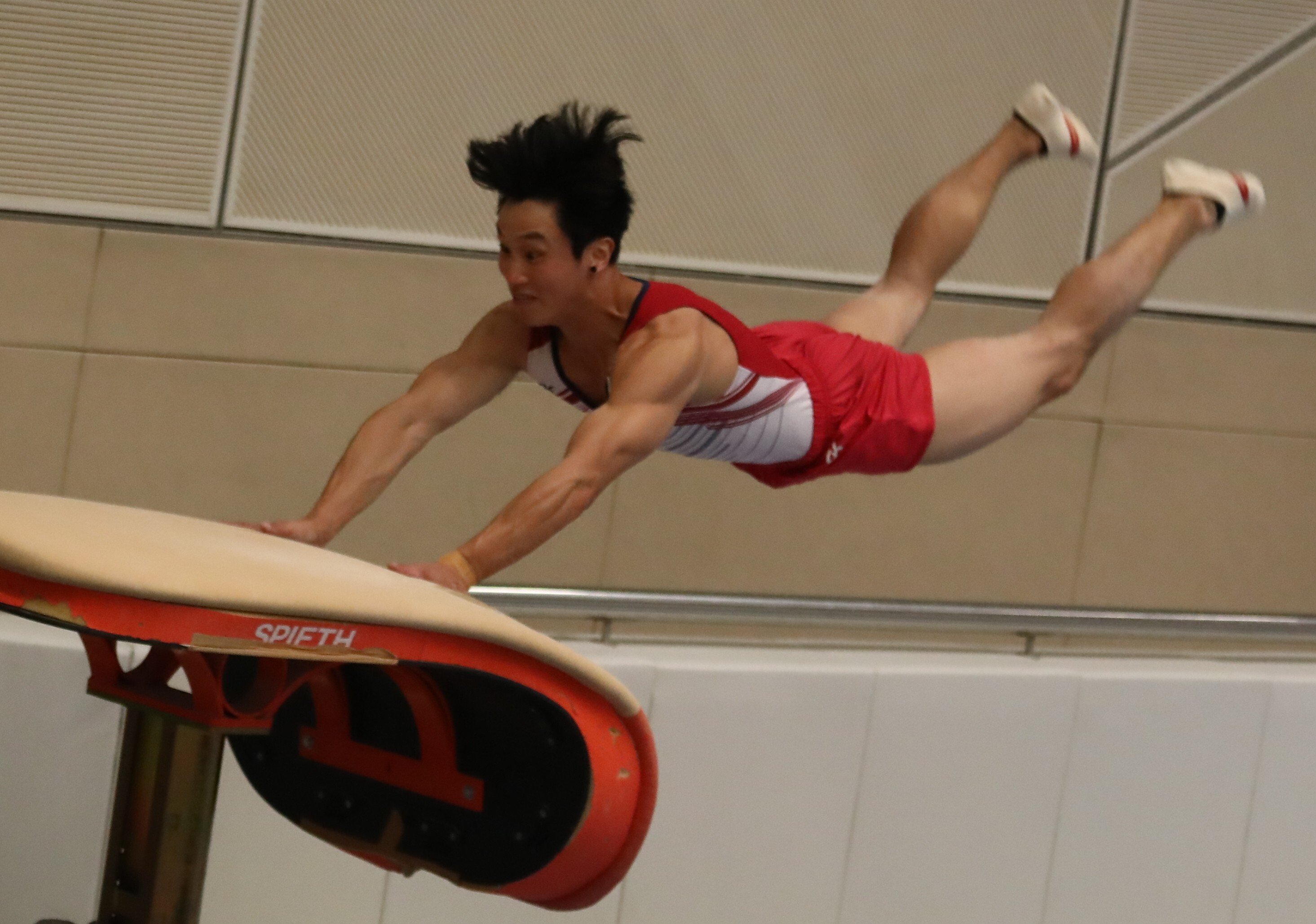 Shek Wai-hung performs a vault jump during a media event at the Shun Lee Tsuen Sports Centre in Kwun Tong on Thursday. Photo: Jonathan Wong