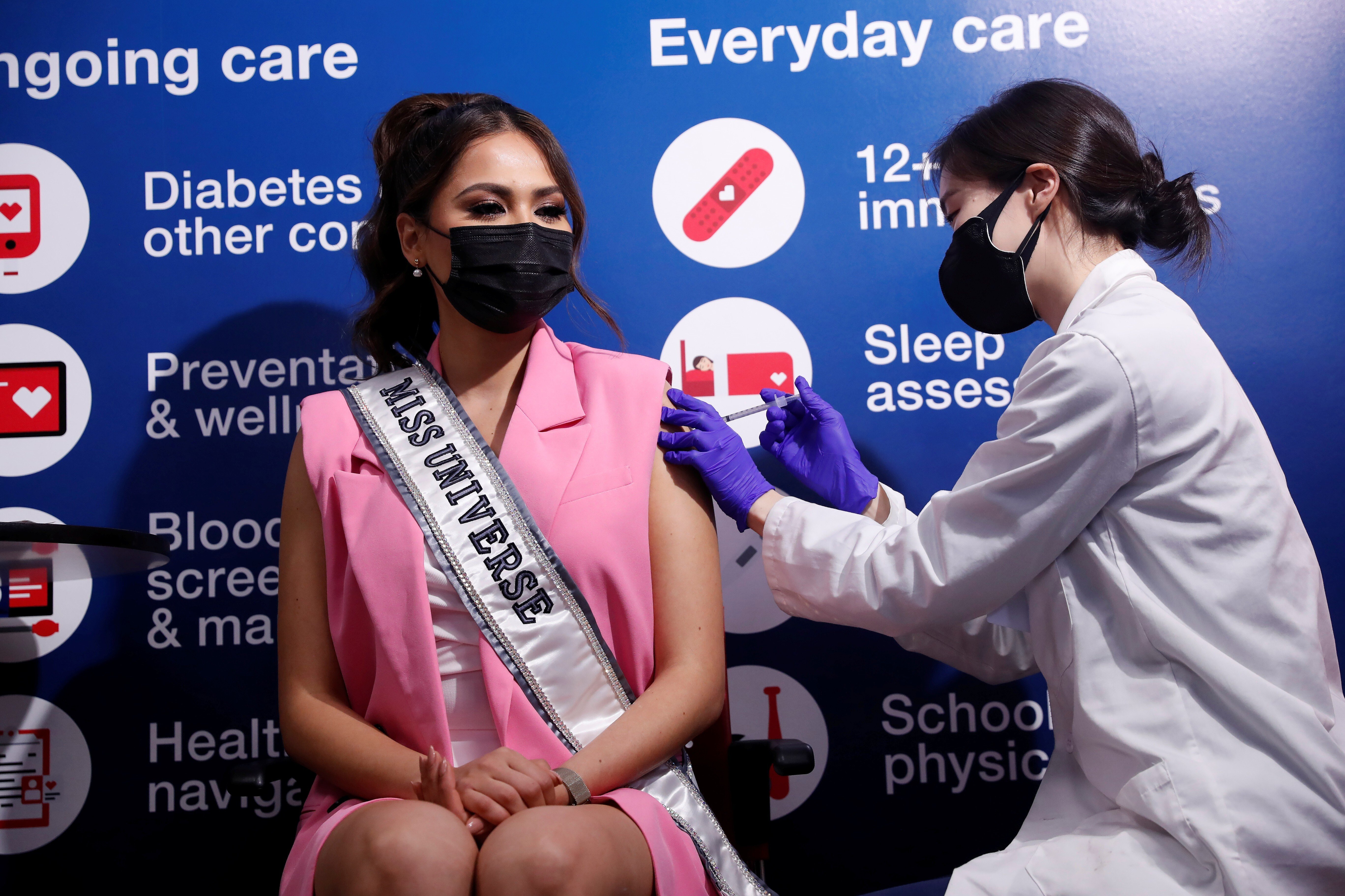 Miss Universe Andrea Meza, of Mexico, winner of the 69th annual Miss Universe competition, receives a dose of the Pfizer-BioNTech vaccine at a CVS Pharmacy store in Manhattan, New York City, on May 26. In the US, half of the country’s adults are fully vaccinated. Photo: Reuters